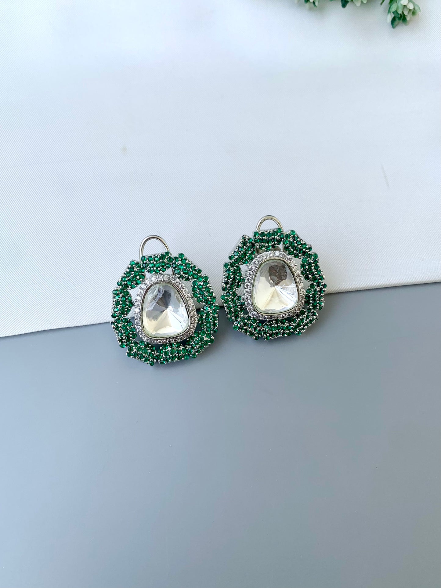 Eliana emerald Swarovski studs in rhodium platinum finish with polki kundan and American diamonds