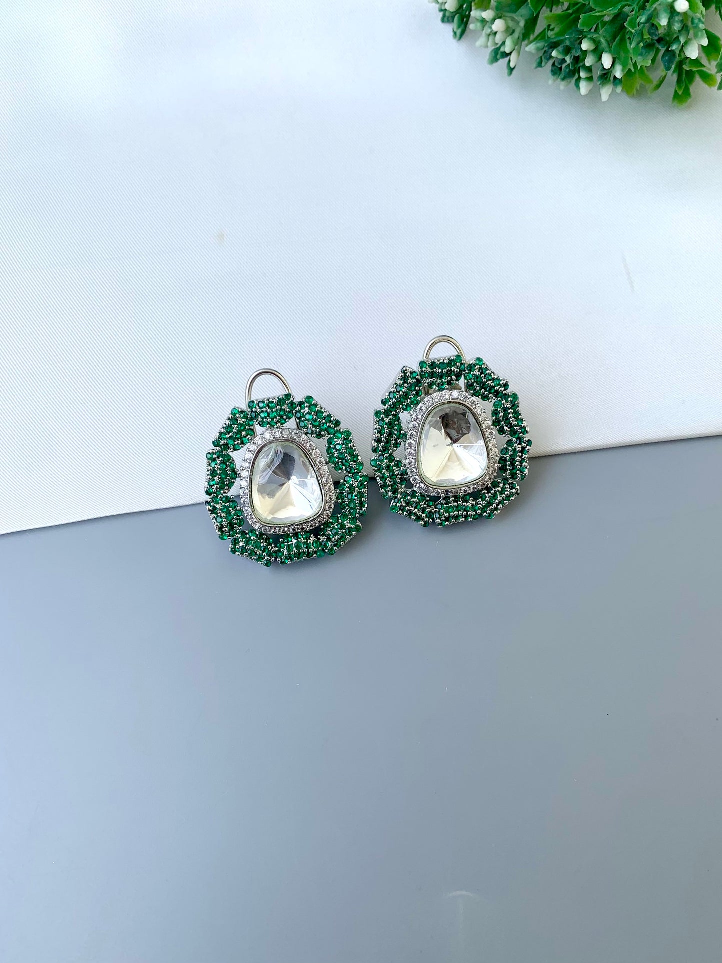 Eliana emerald Swarovski studs in rhodium platinum finish with polki kundan and American diamonds