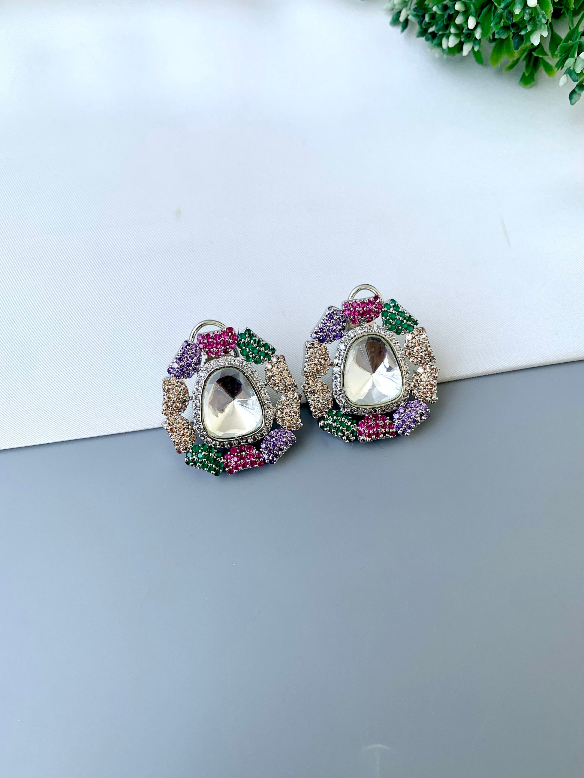 Eliana multi Swarovski studs in rhodium platinum finish with polki kundan and American diamonds
