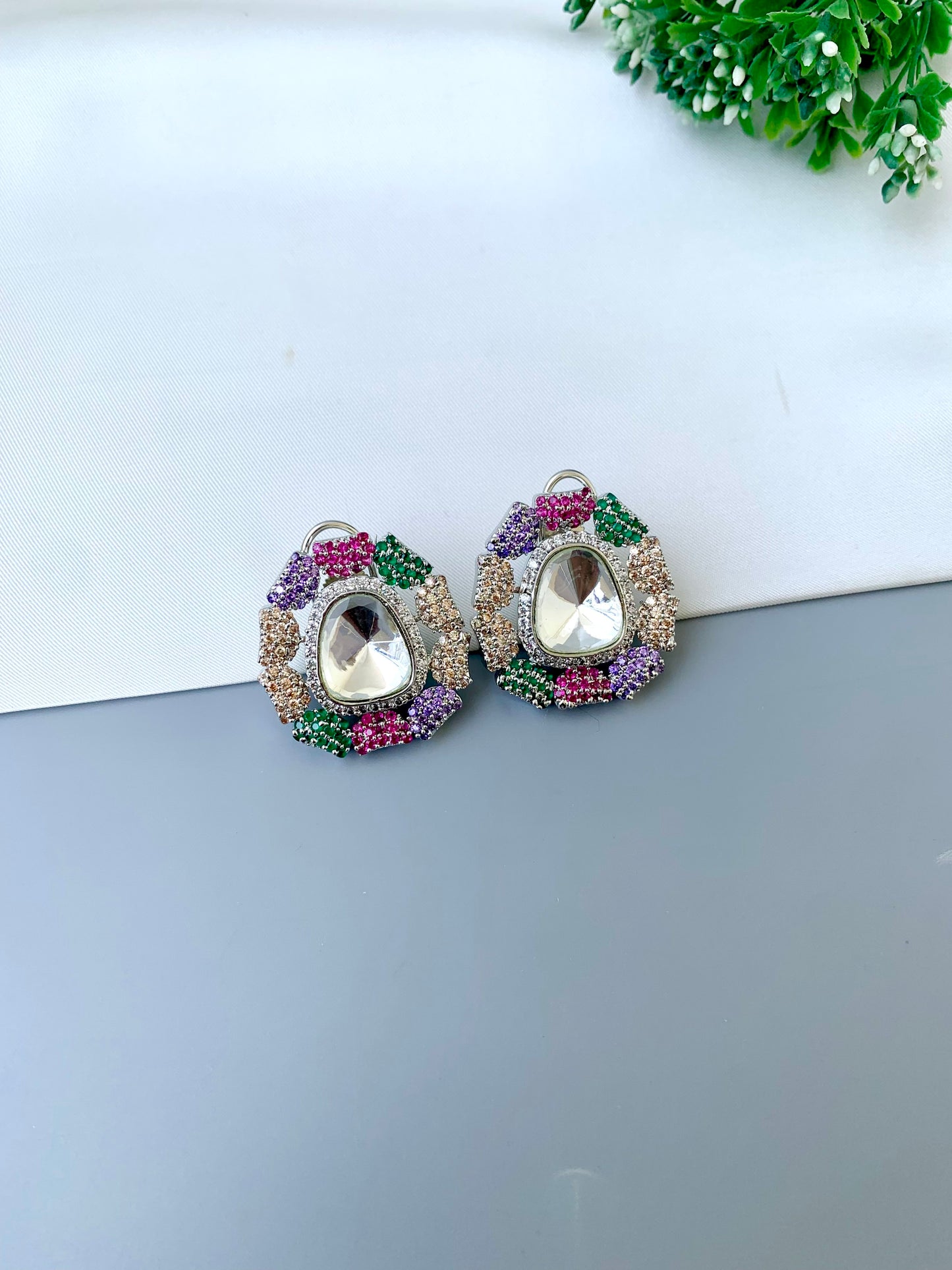 Eliana multi Swarovski studs in rhodium platinum finish with polki kundan and American diamonds