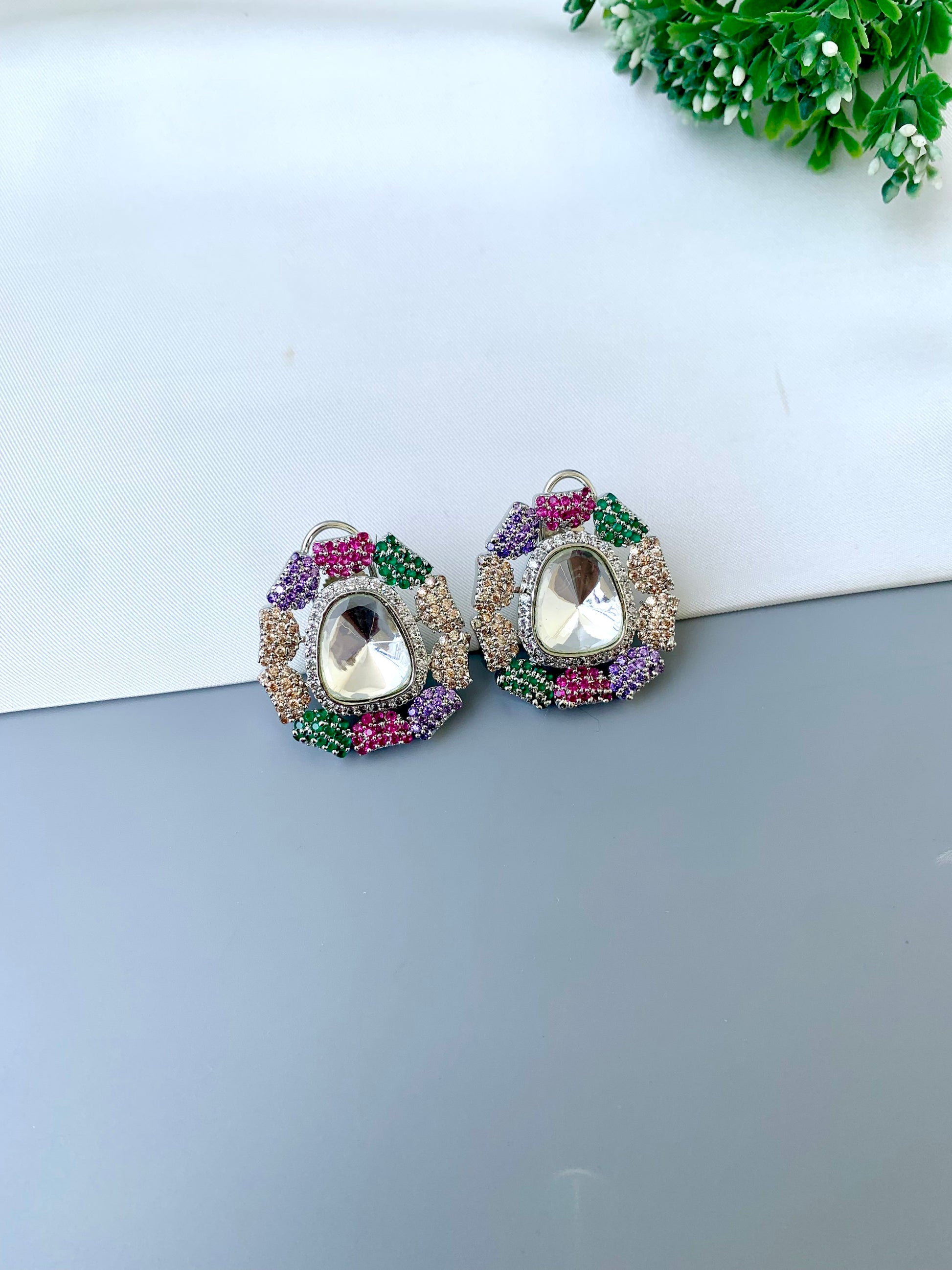 Eliana multi Swarovski studs in rhodium platinum finish with polki kundan and American diamonds