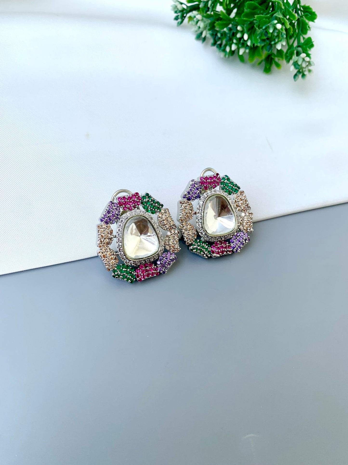 Eliana multi Swarovski studs in rhodium platinum finish with polki kundan and American diamonds