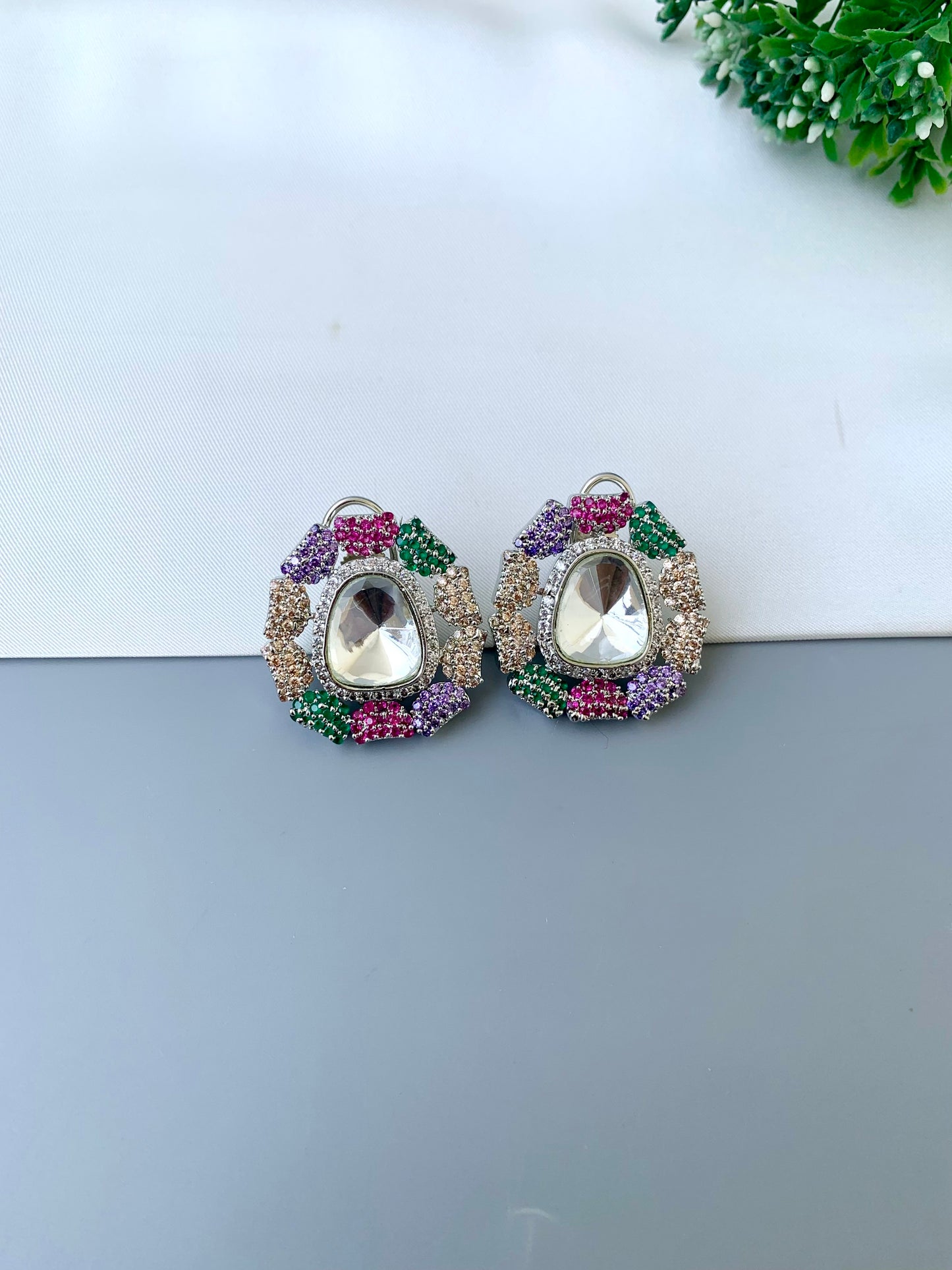 Eliana multi Swarovski studs in rhodium platinum finish with polki kundan and American diamonds
