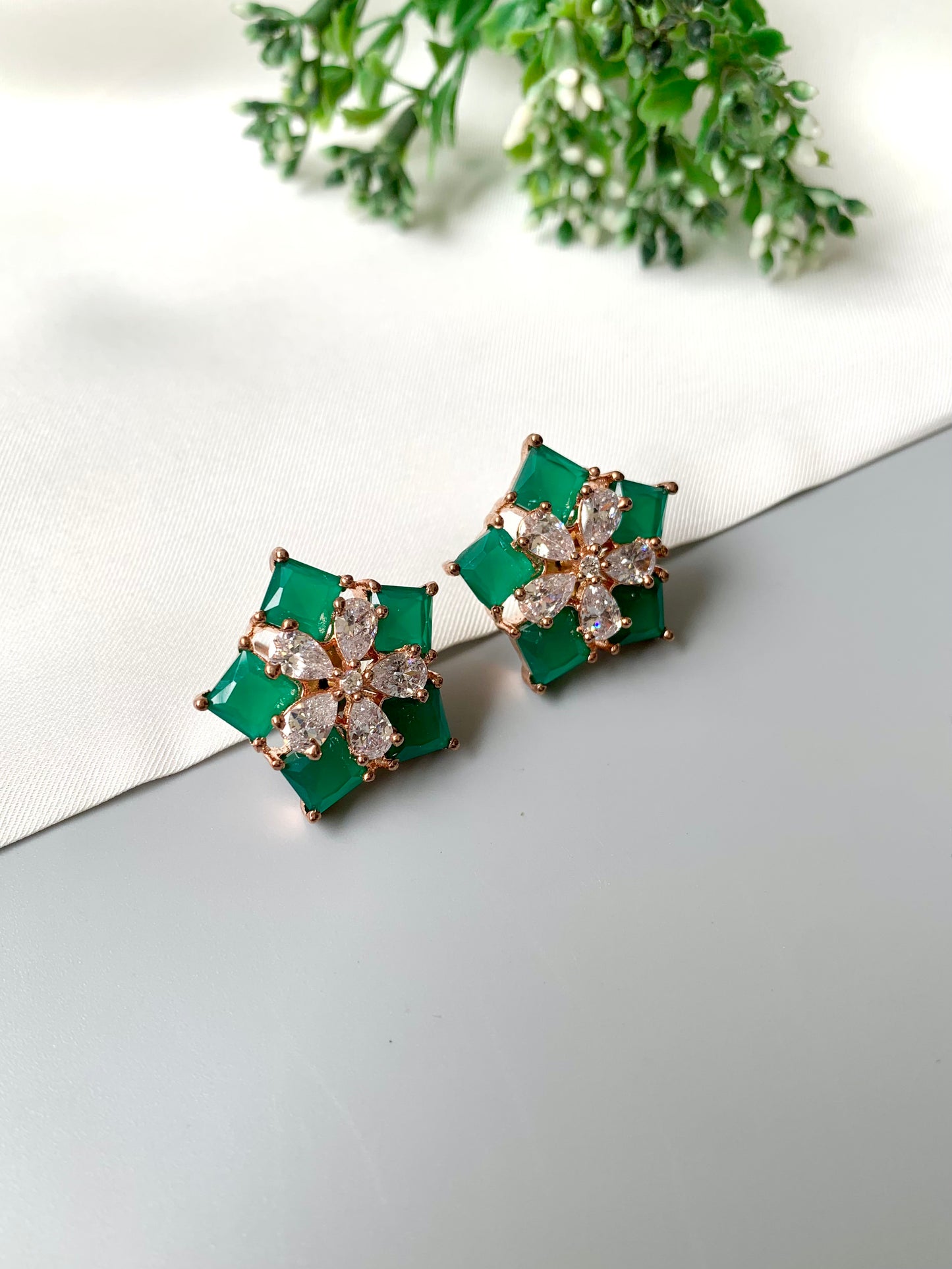 Zamal Jewels emerald prism studs displayed flat