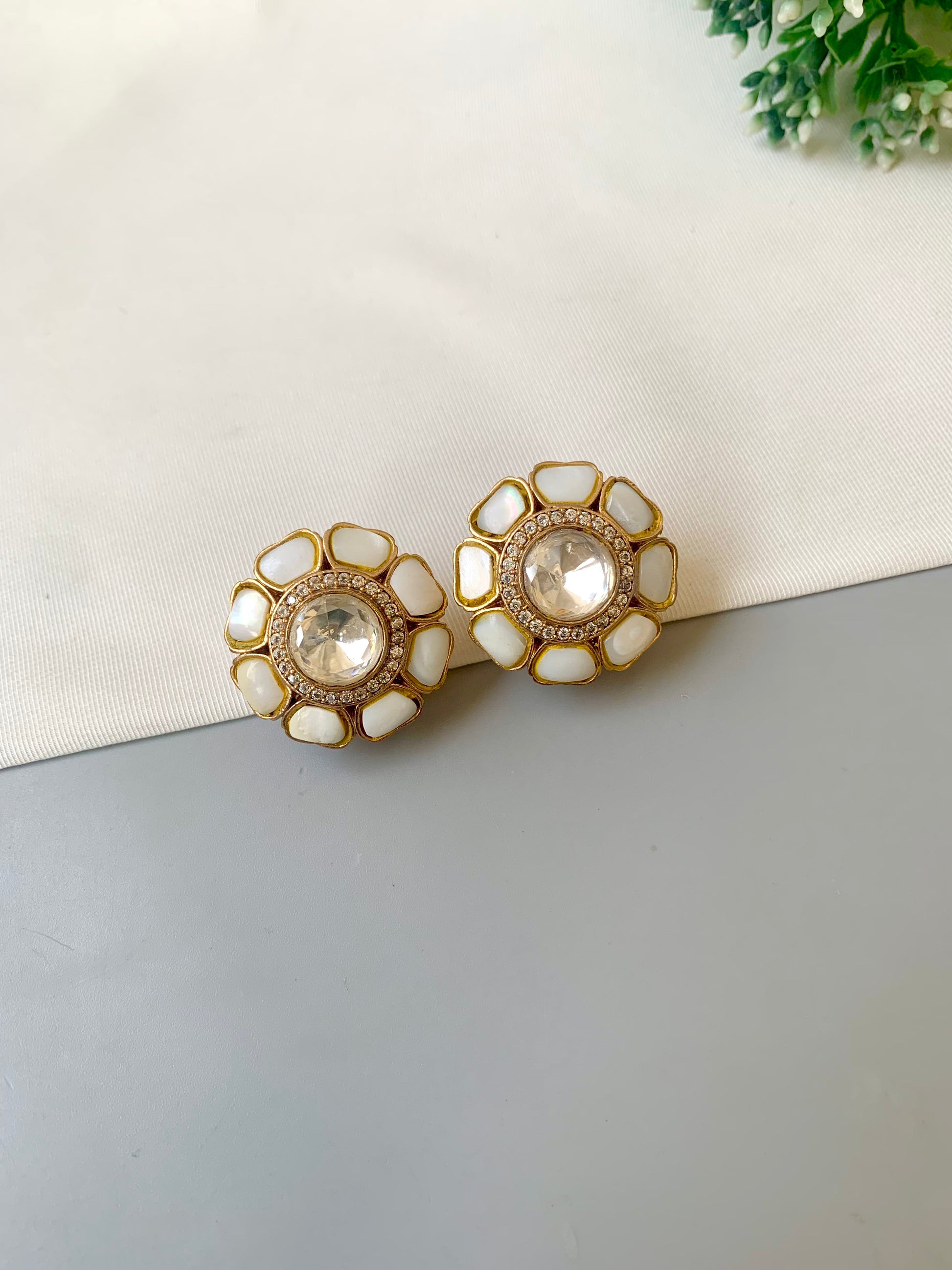 Hand crafted Fleur flower-shaped studs in 22kt gold plating with American Diamonds, Polki Kundan and real Mother of Pearl