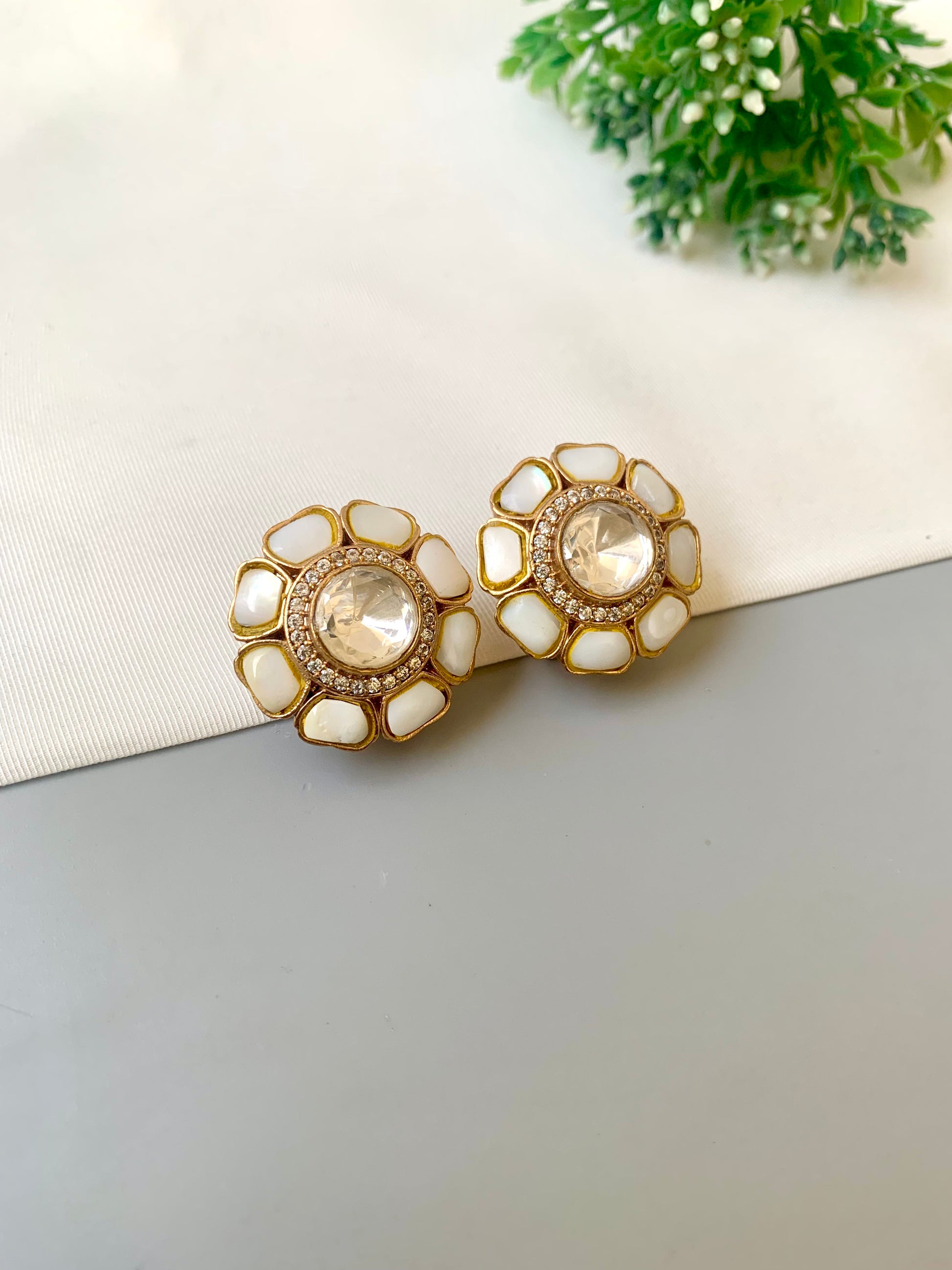 Hand crafted Fleur flower-shaped studs in 22kt gold plating with American Diamonds, Polki Kundan and real Mother of Pearl
