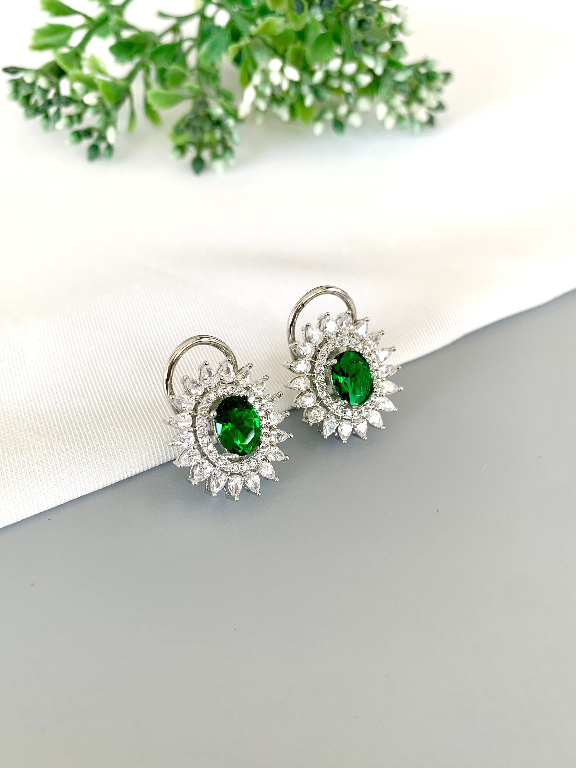 Front view of Hermona Hydro Emerald Studs in rhodium plating with American Diamonds