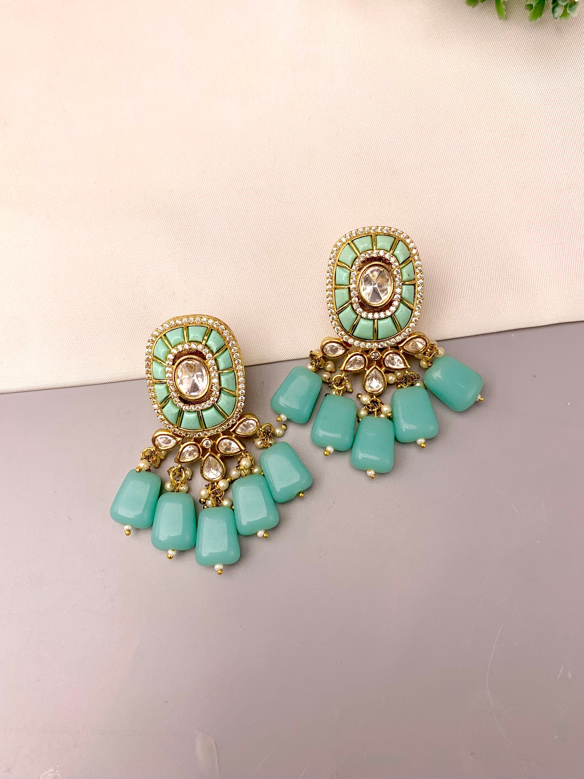 Irmah handcrafted 22kt gold plated earrings featuring American Diamonds, Polki Kundan, semi-precious Pearls, and Feroza