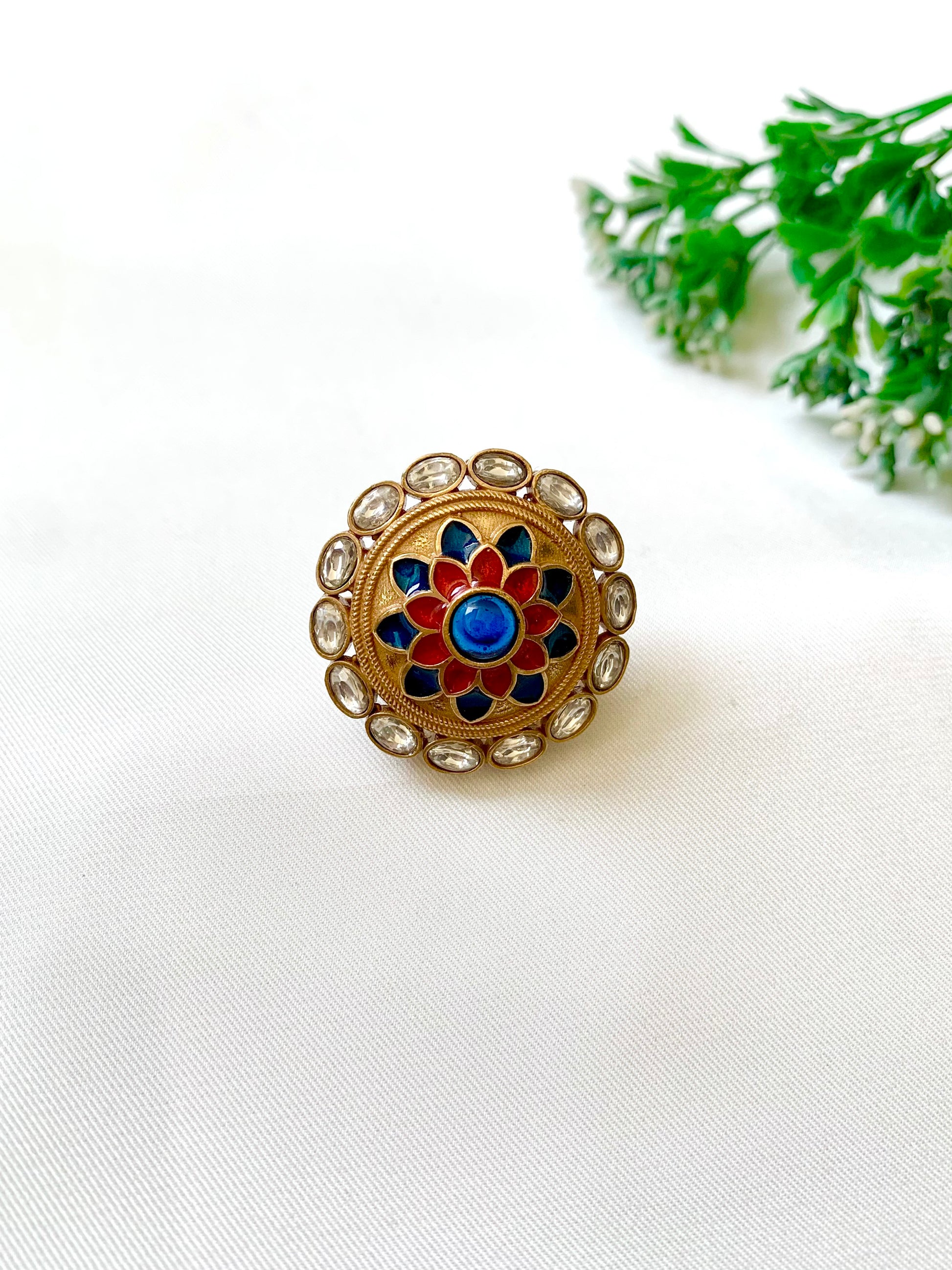 Decorative ring with floral design on a white background