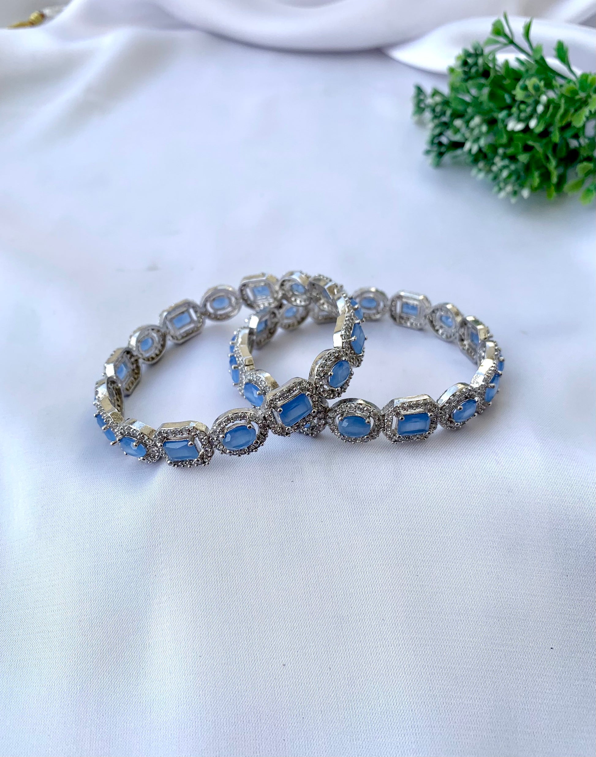Julias onyx rhodium plated bangles in platinum polish with American diamonds