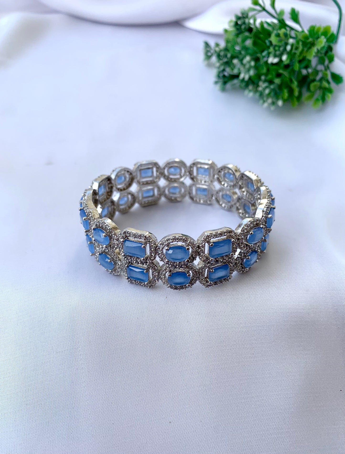Julias onyx rhodium plated bangles in platinum polish with American diamonds