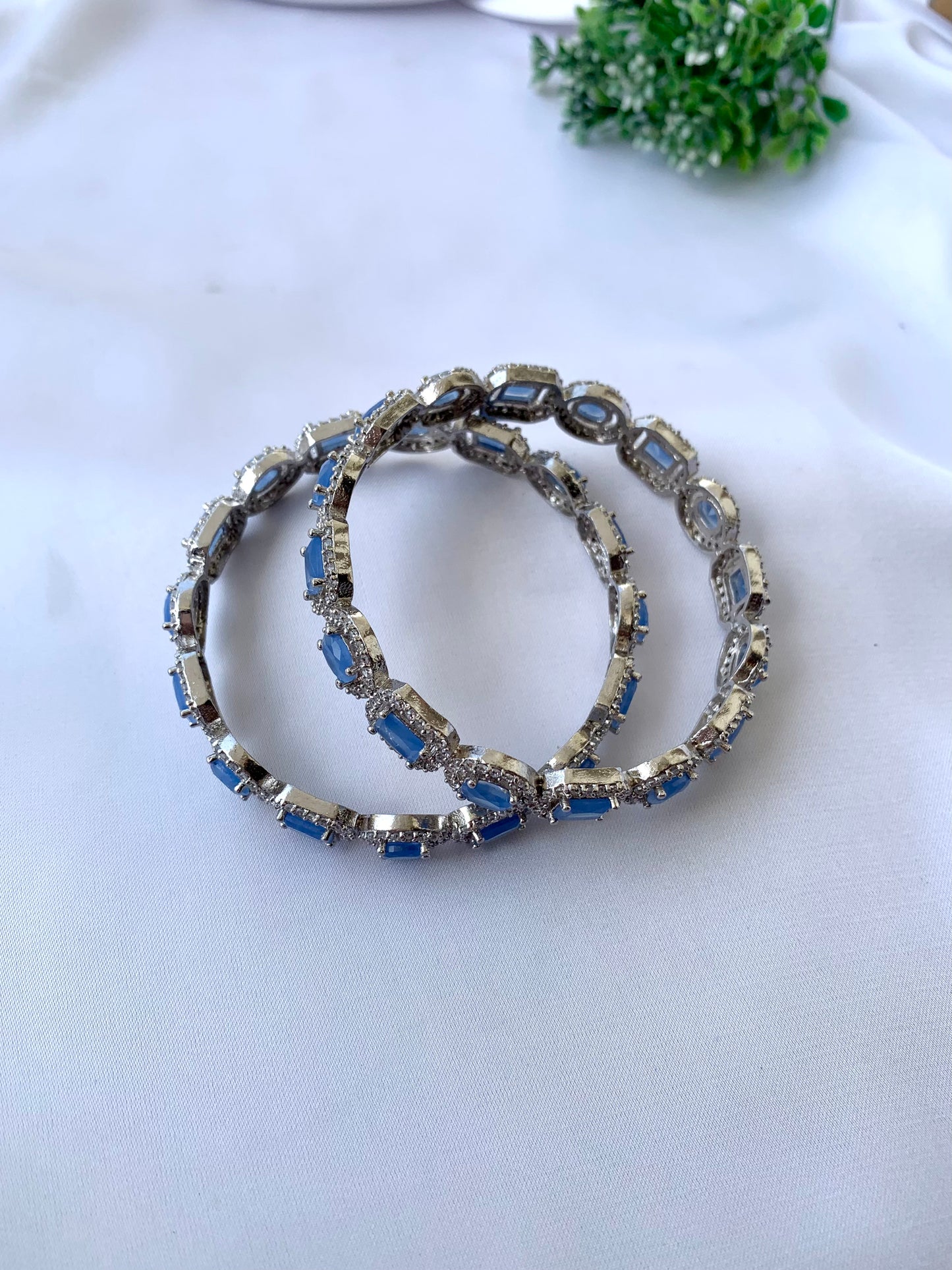 Julias onyx rhodium plated bangles in platinum polish with American diamonds