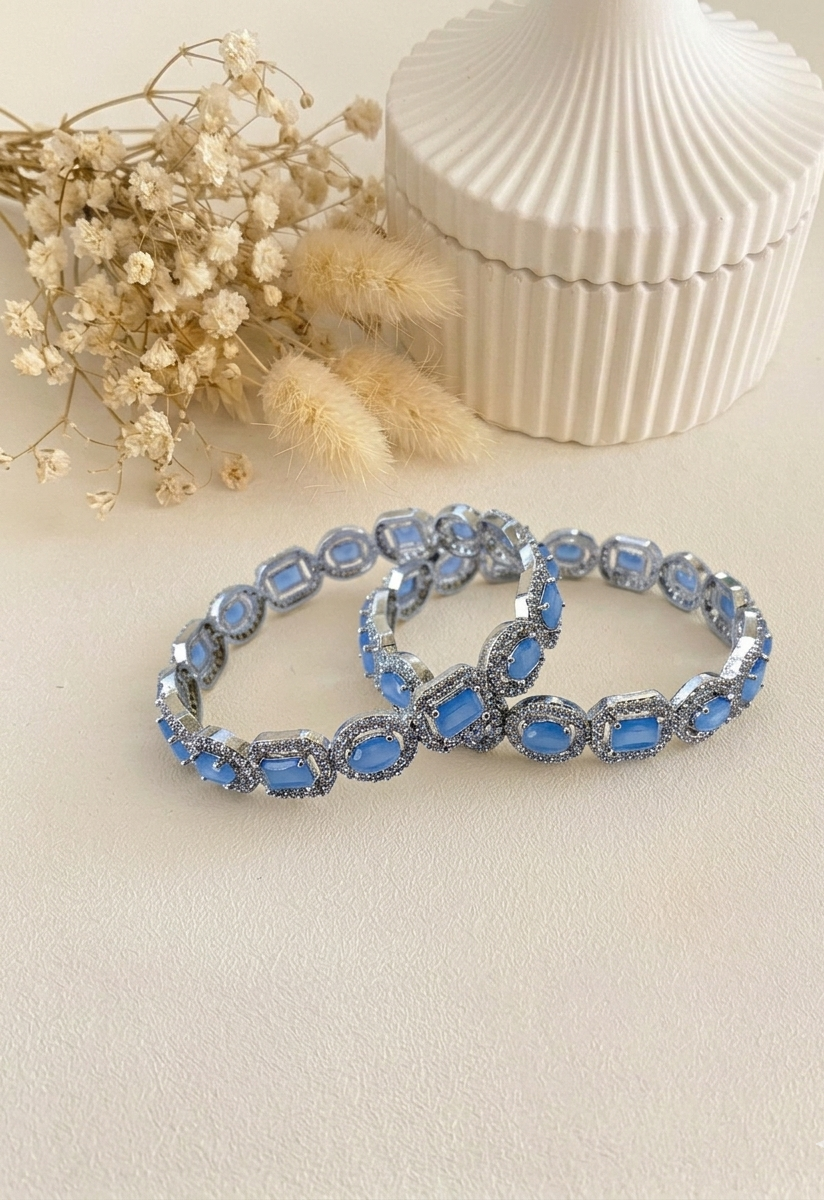 Julias onyx rhodium plated bangles in platinum polish with American diamonds
