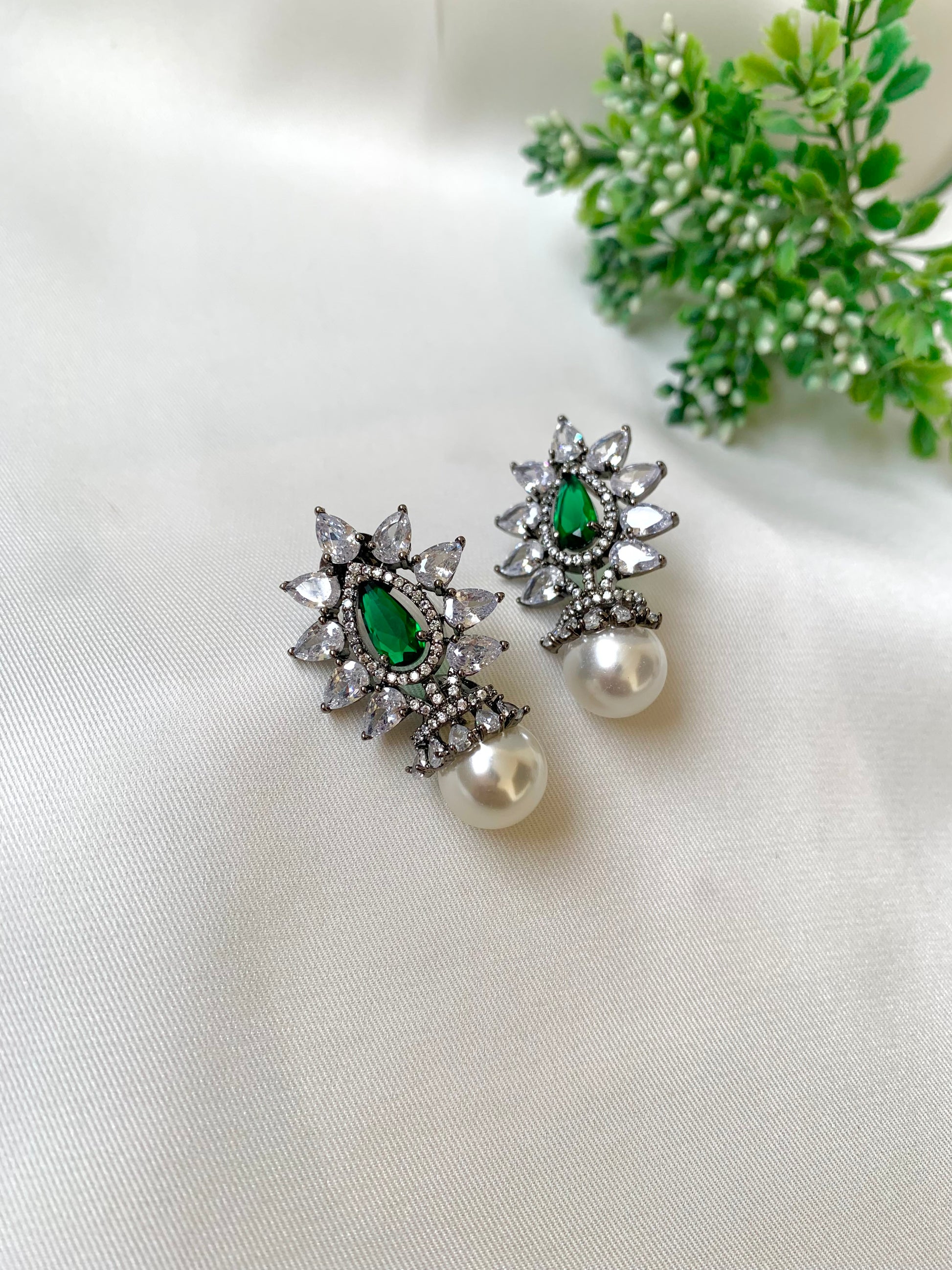Hand crafted Kairo Emerald earrings in rhodium oxidized polish featuring American Diamonds, semi-precious pearls and emerald