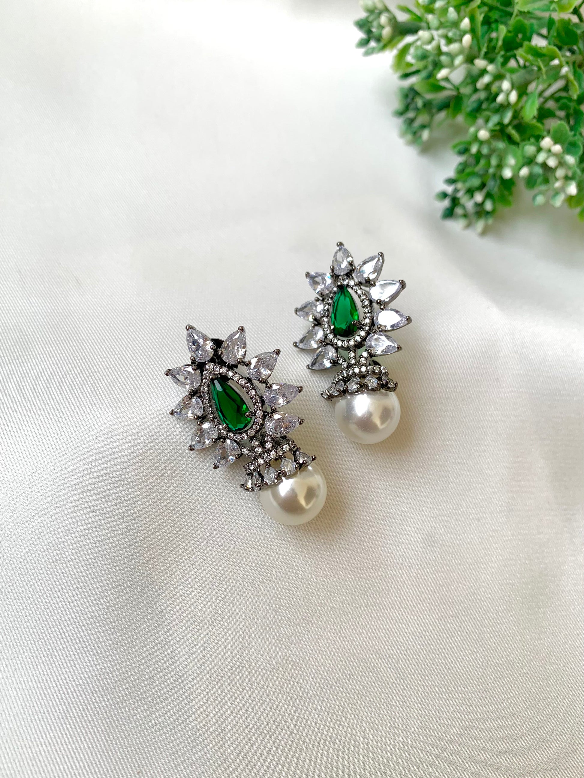 Hand crafted Kairo Emerald earrings in rhodium oxidized polish featuring American Diamonds, semi-precious pearls and emerald