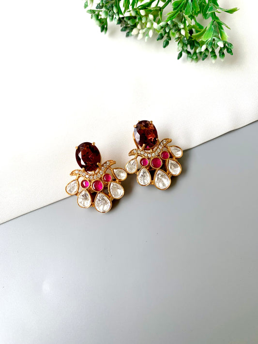 Front view of Kavia Amethyst earrings with ruby, amethyst and Polki Kundan stones in oxidized 22kt gold.