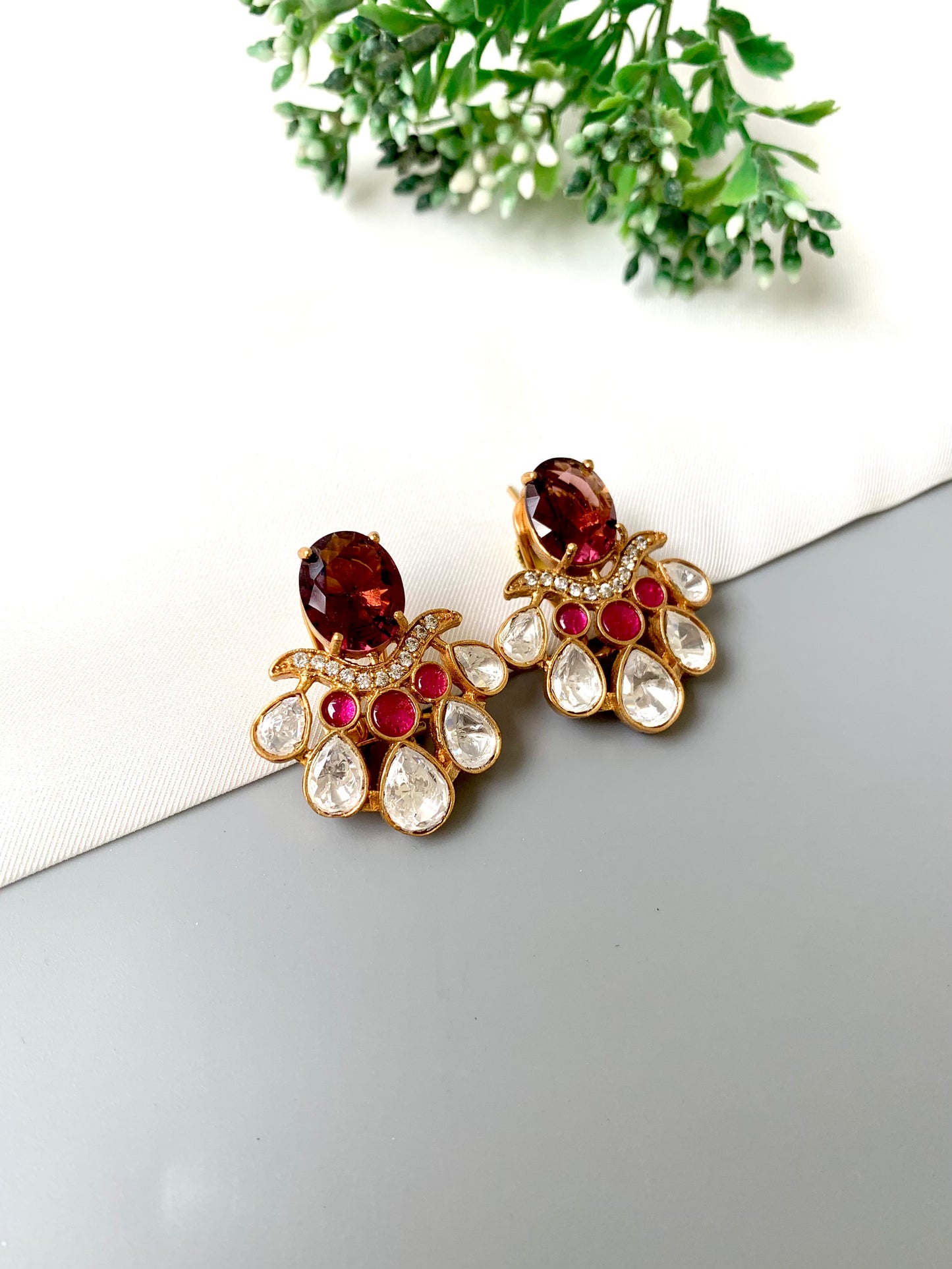 Side view of Kavia Amethyst earrings highlighting intricate Polki Kundan setting and ruby placement.