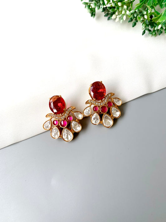 Front view of Kavia Ruby earrings with ruby, Polki Kundan, and American Diamonds in 22kt gold.