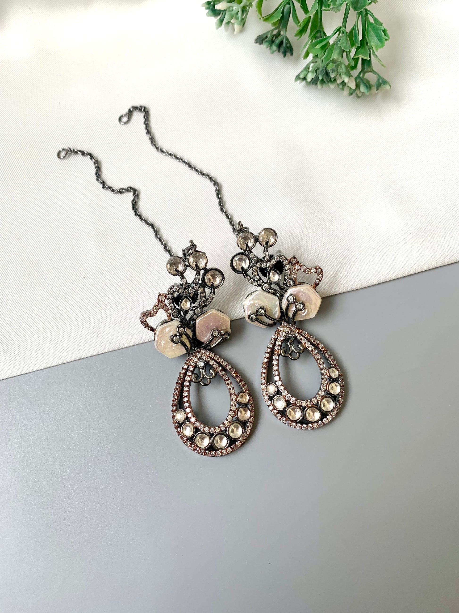 Kenza designer earrings in rhodium and rose gold oxidized finish with polki kundan and baroque pearls