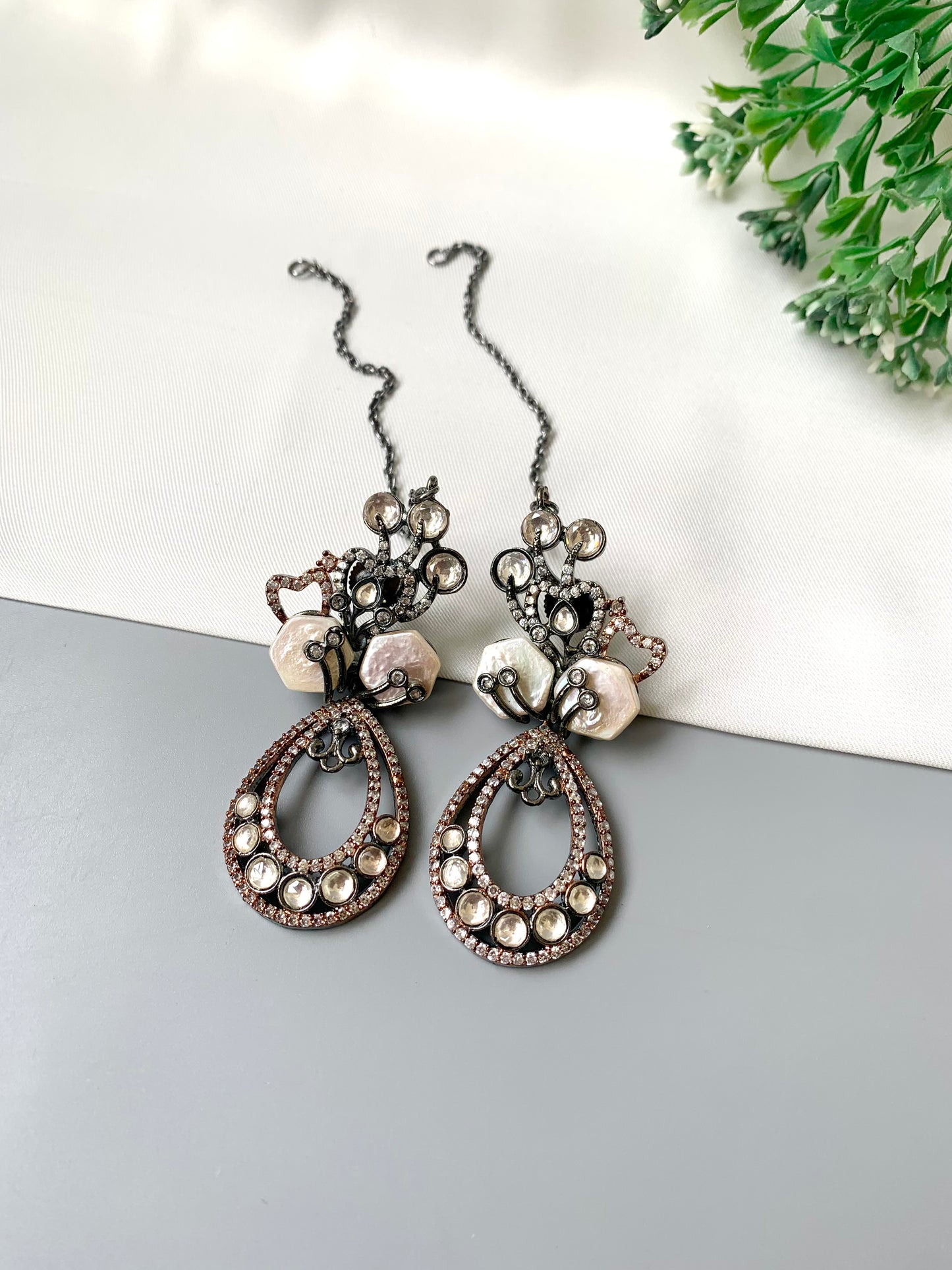 Kenza designer earrings in rhodium and rose gold oxidized finish with polki kundan and baroque pearls