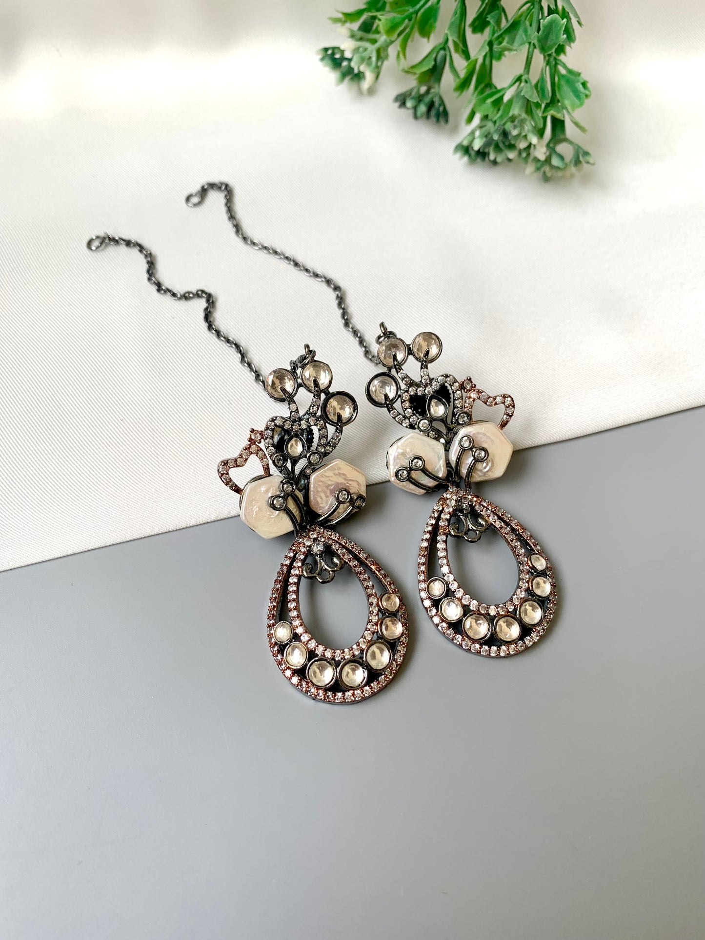 Kenza designer earrings in rhodium and rose gold oxidized finish with polki kundan and baroque pearls