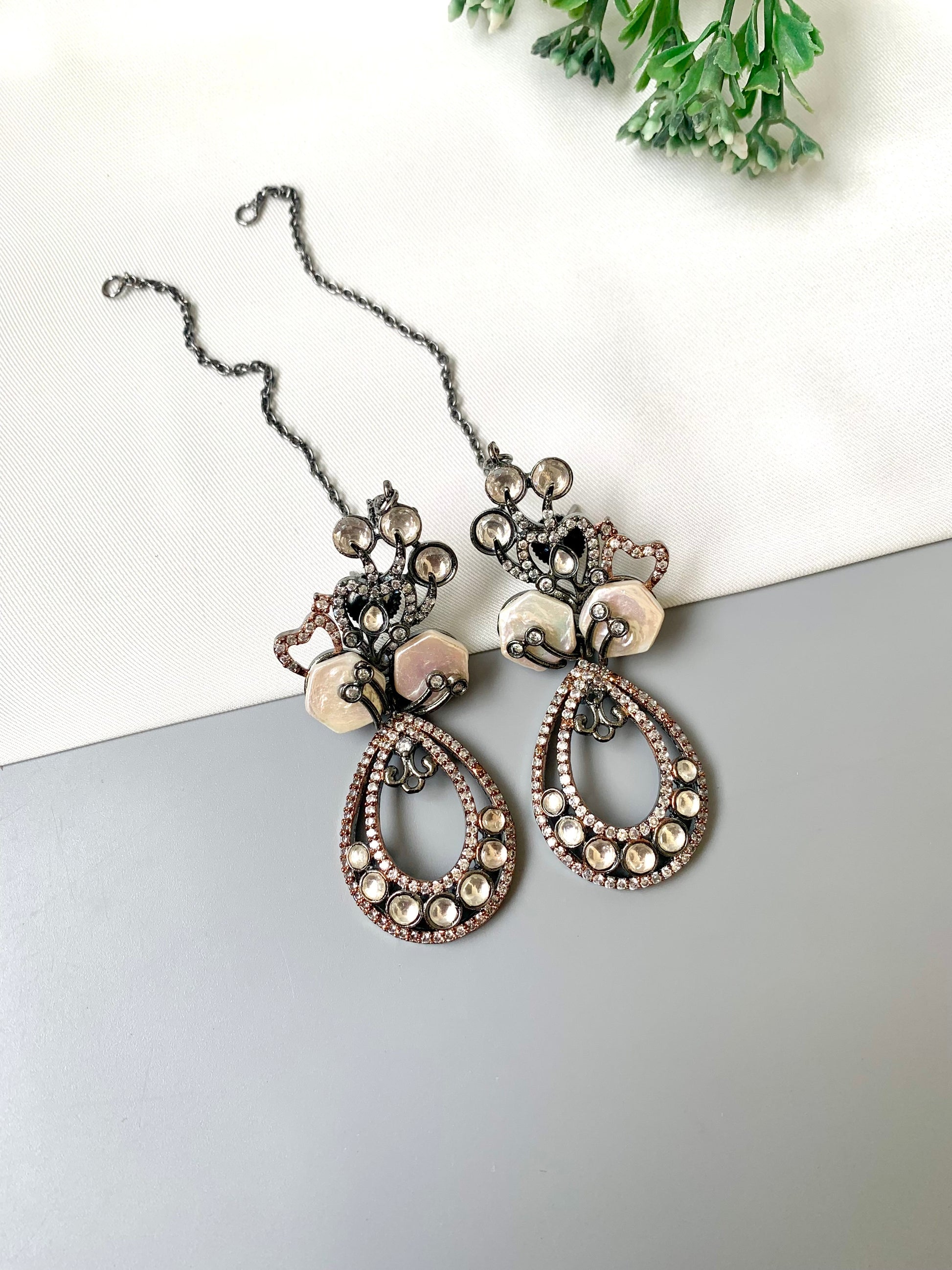 Kenza designer earrings in rhodium and rose gold oxidized finish with polki kundan and baroque pearls
