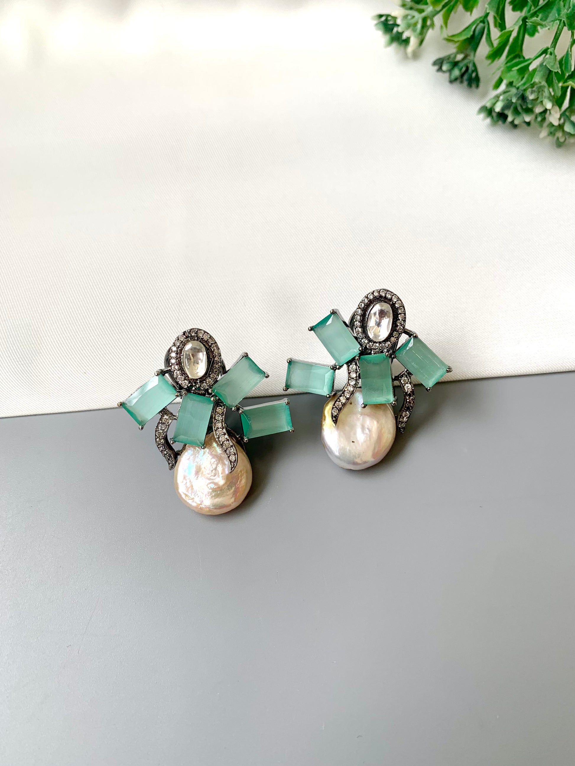 Klara mint onyx polki kundan studs in rhodium oxidized finish with baroque pearls