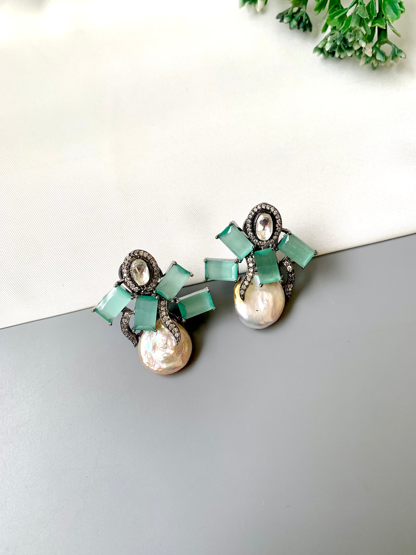 Klara mint onyx polki kundan studs in rhodium oxidized finish with baroque pearls