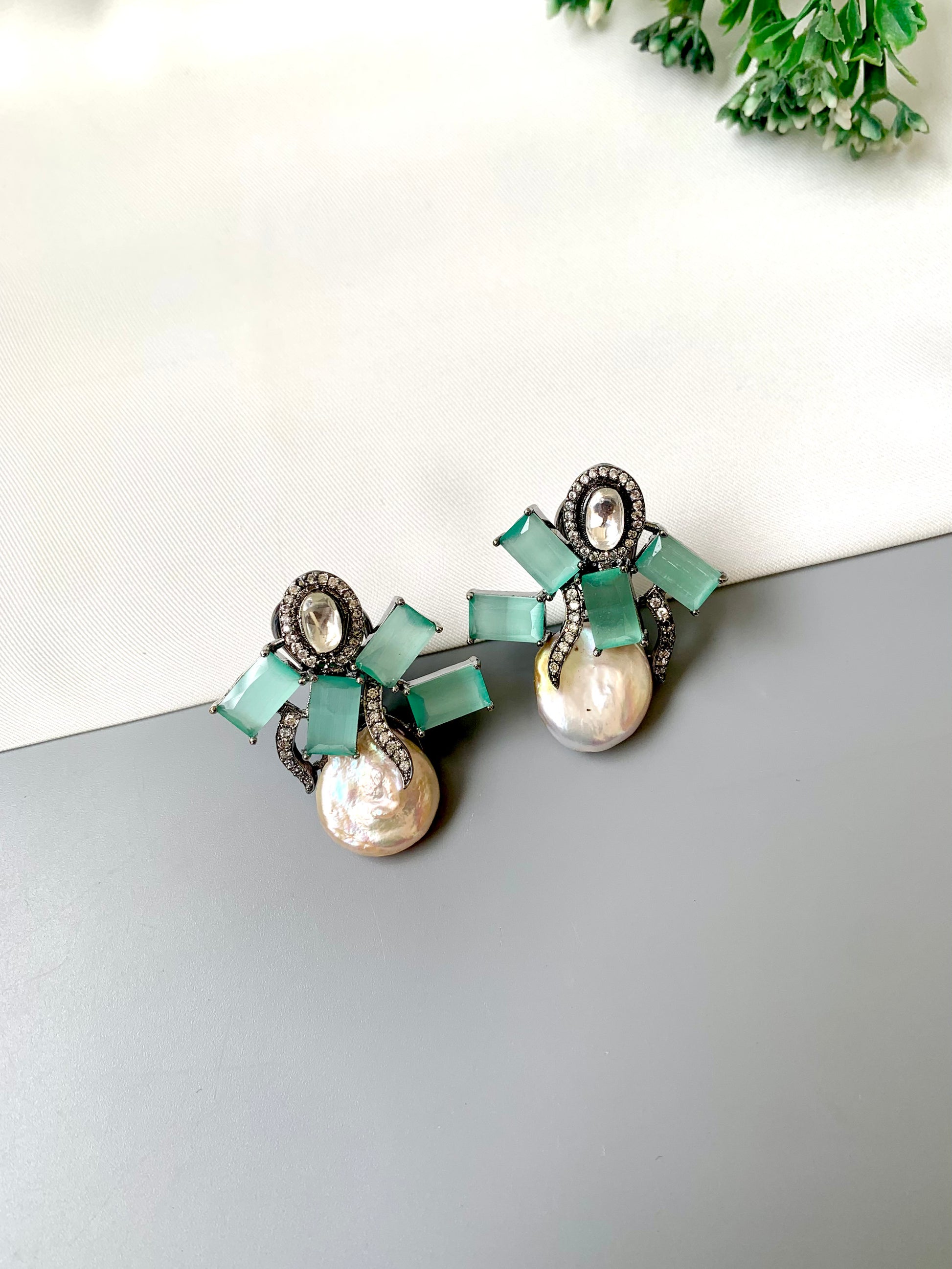 Klara mint onyx polki kundan studs in rhodium oxidized finish with baroque pearls