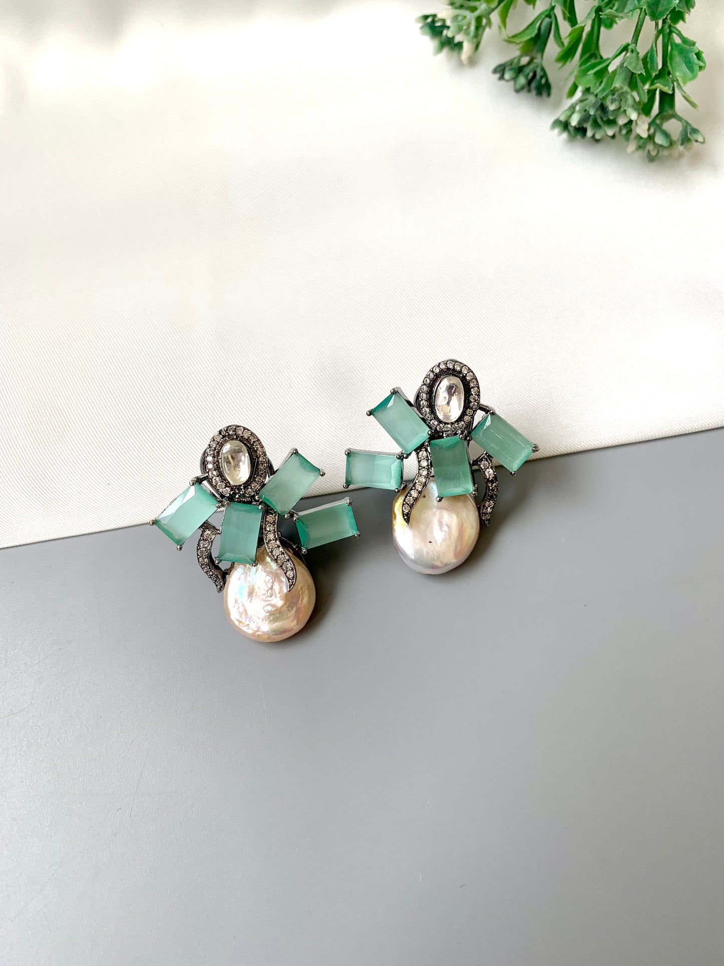 Klara mint onyx polki kundan studs in rhodium oxidized finish with baroque pearls