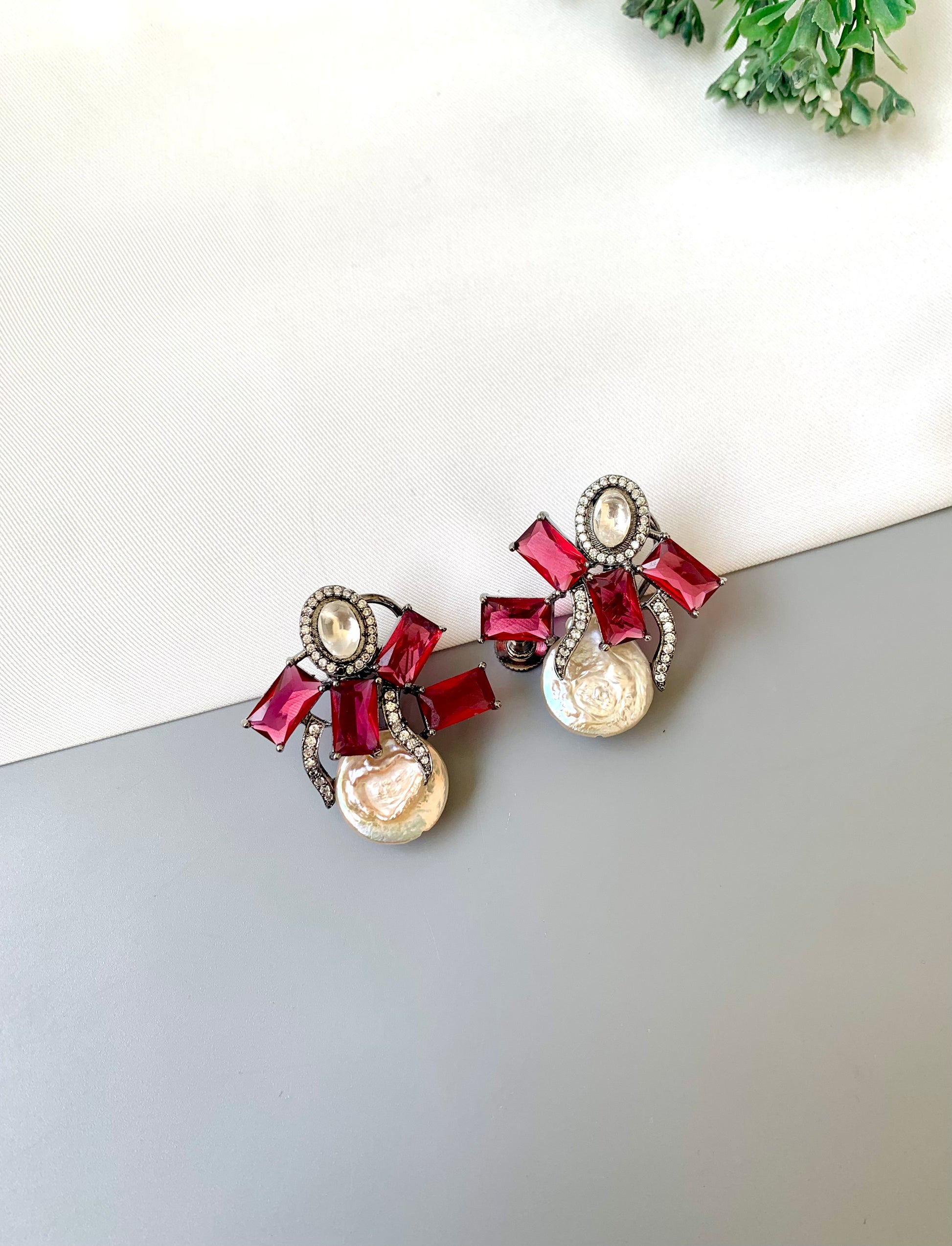 Klara ruby polki kundan studs in rhodium oxidized finish with baroque pearls