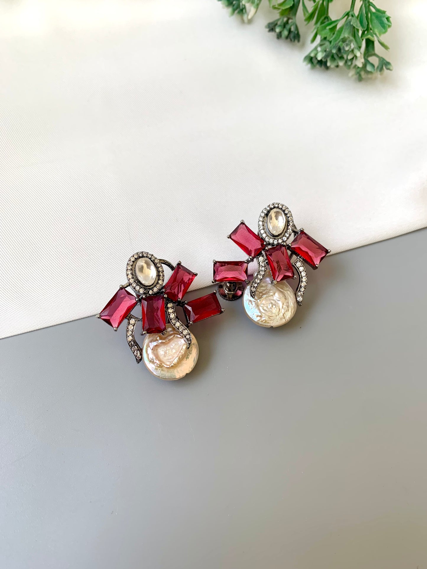 Klara ruby polki kundan studs in rhodium oxidized finish with baroque pearls