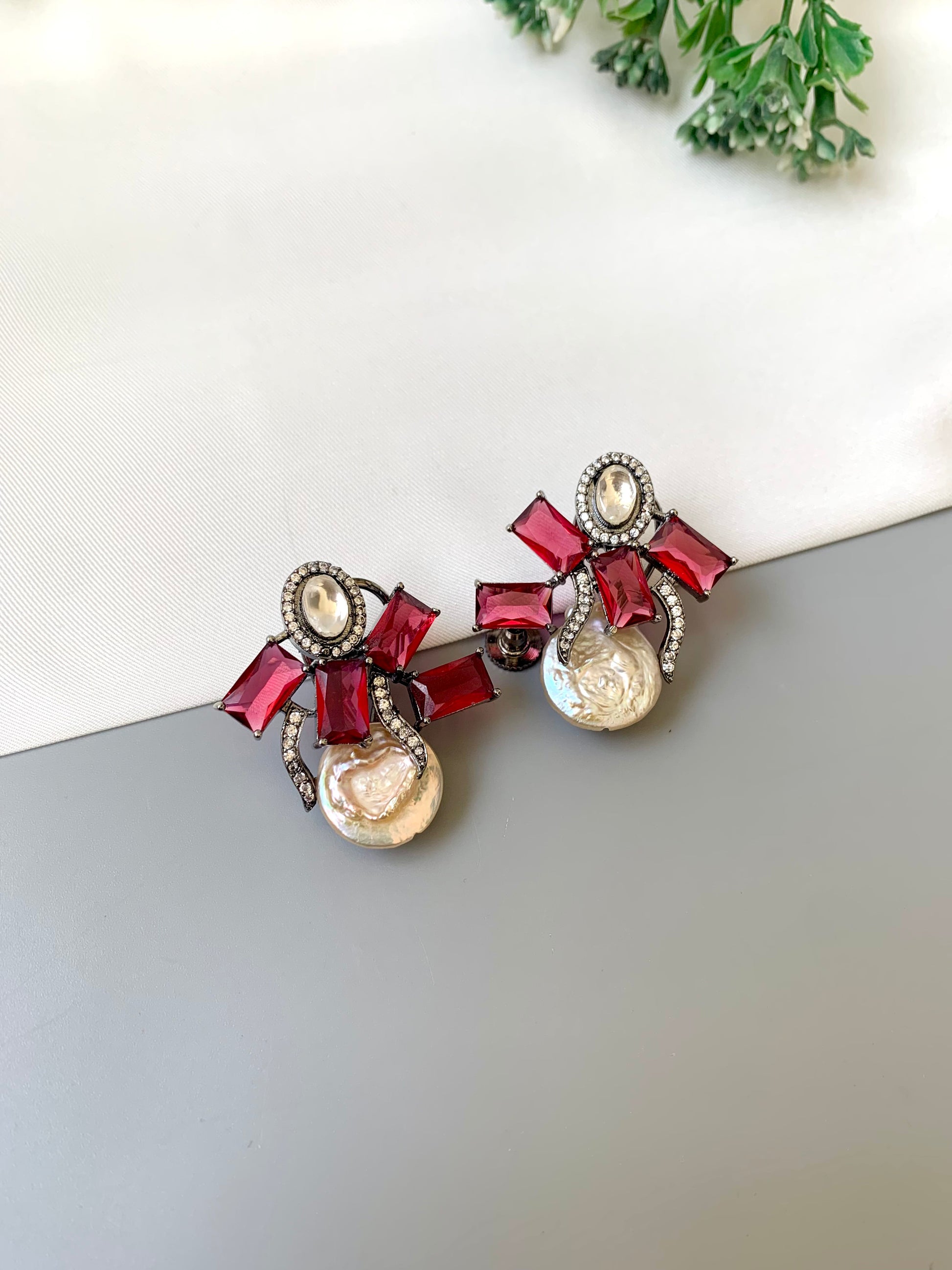 Klara ruby polki kundan studs in rhodium oxidized finish with baroque pearls