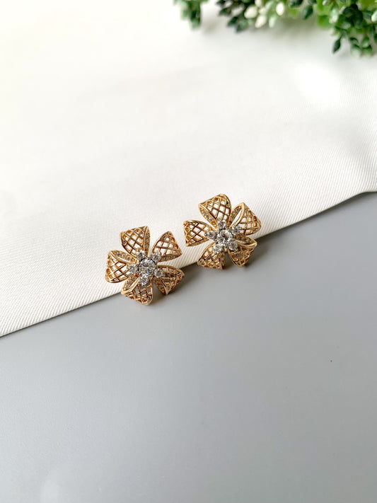 Front view of Liora Bloom floral studs with American Diamonds in rose gold finish.