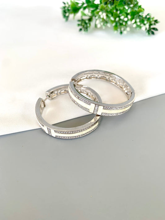 liora-rhodium-hoops-front-zamaljewels.jpg
Front view of Liora Rhodium Hoops with twin rows of American Diamonds and Mother of Pearl inlay