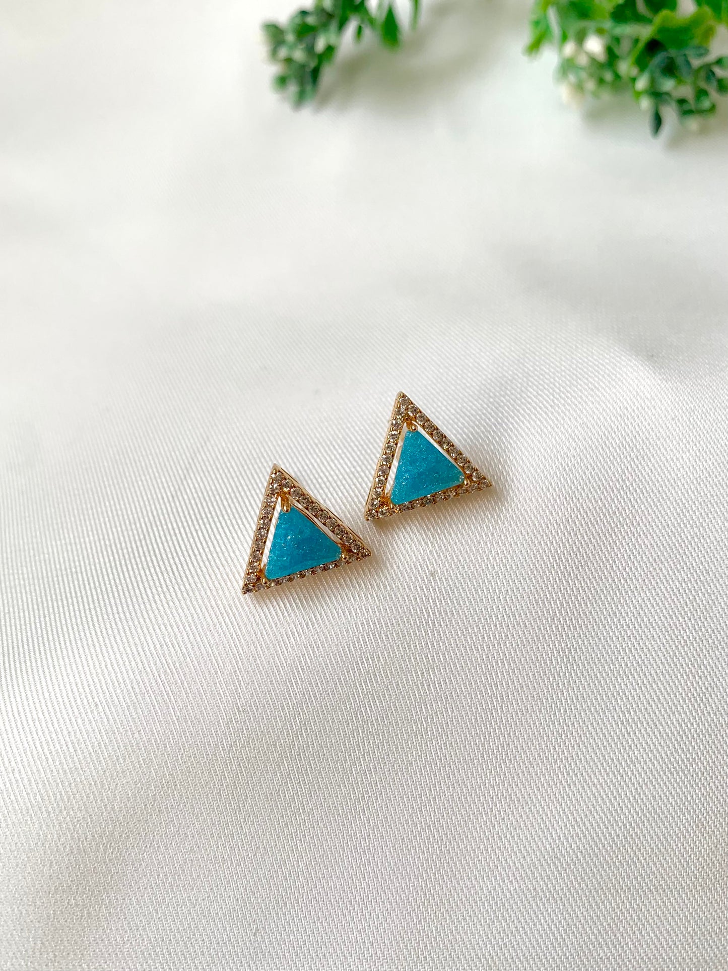 Delicate triangular Lumi studs in 22kt gold plating with American Diamonds and pastel blue natural milky stone