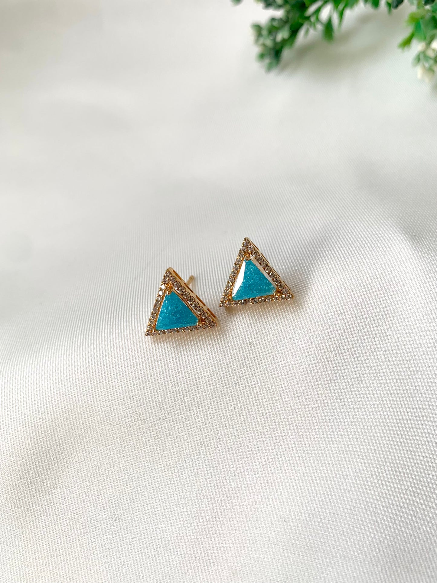 Delicate triangular Lumi studs in 22kt gold plating with American Diamonds and pastel blue natural milky stone