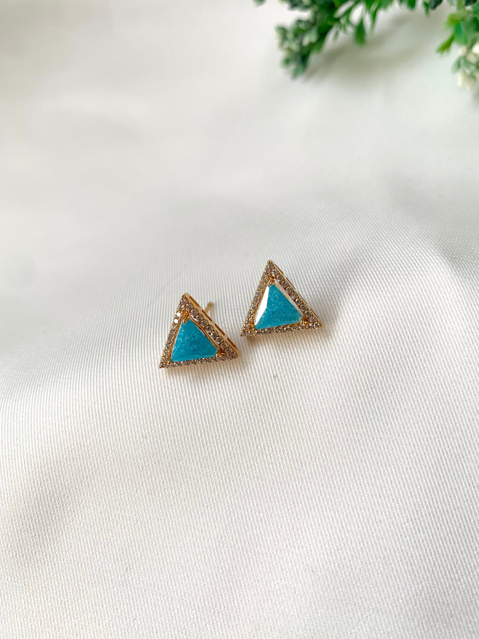 Delicate triangular Lumi studs in 22kt gold plating with American Diamonds and pastel blue natural milky stone