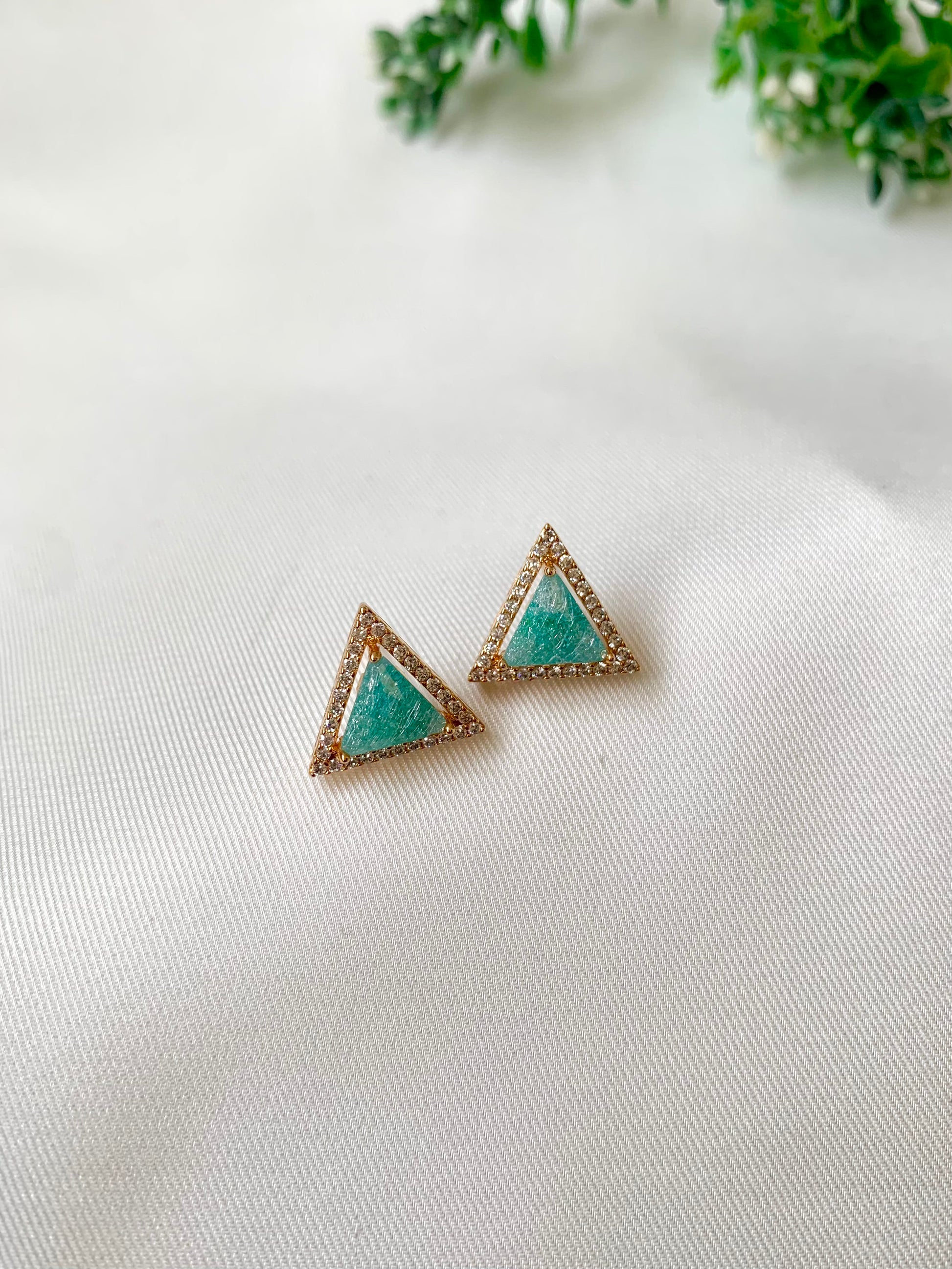 Delicate triangular Lumi studs in 22kt gold plating with American Diamonds and pastel green natural milky stone