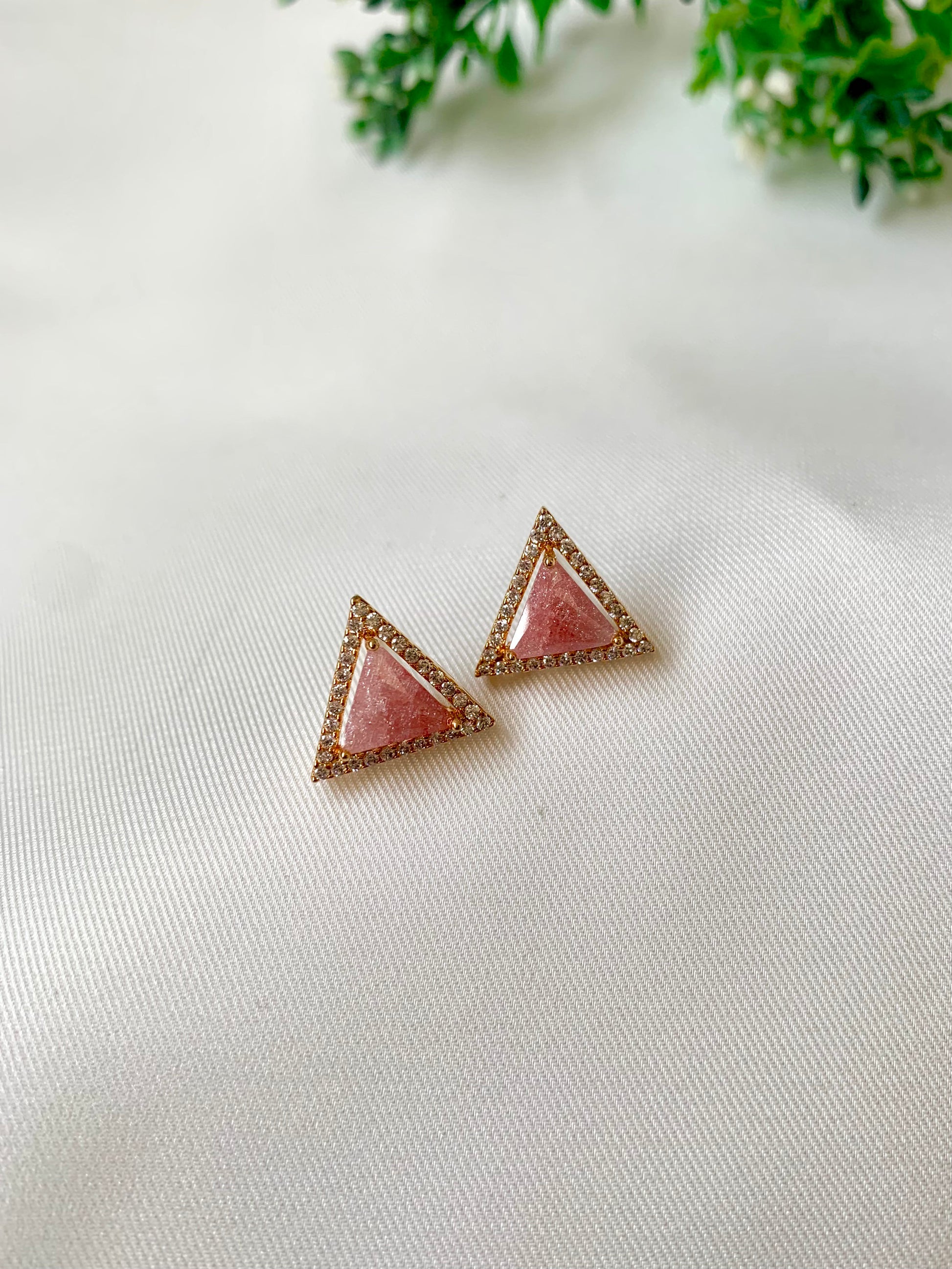 Delicate triangular Lumi studs in 22kt gold plating with American Diamonds and pastel pink natural milky stone