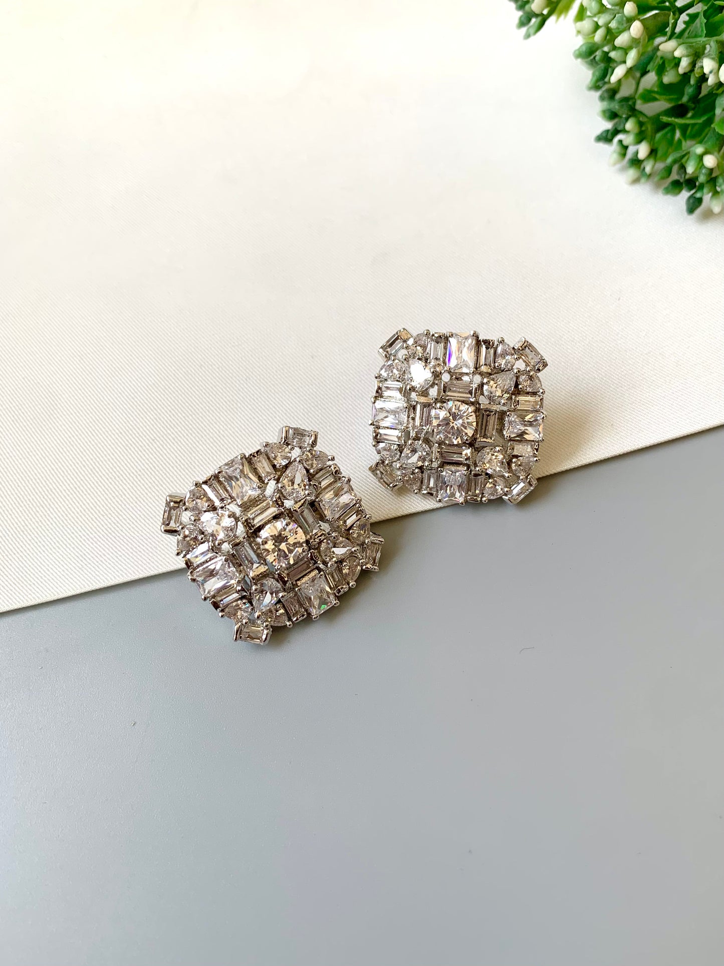 Rhodium-plated Lumière Solitaire Studs with high-quality American Diamonds and diamond finish