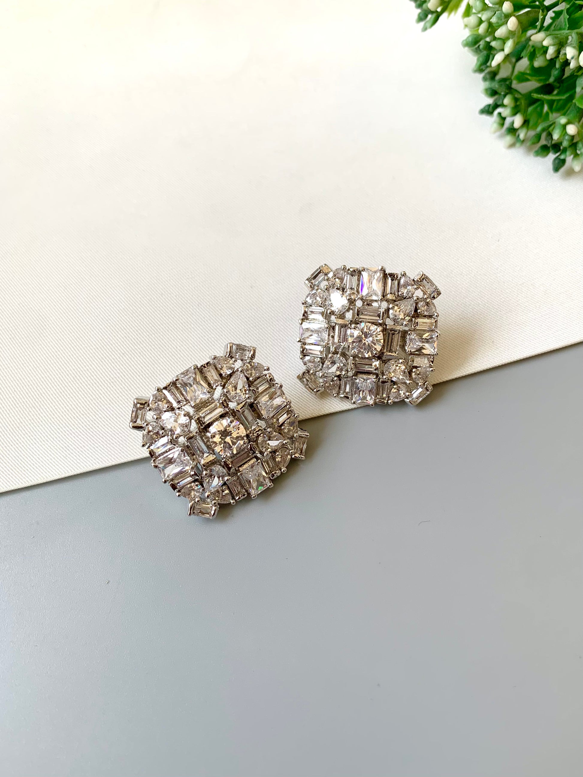 Rhodium-plated Lumière Solitaire Studs with high-quality American Diamonds and diamond finish