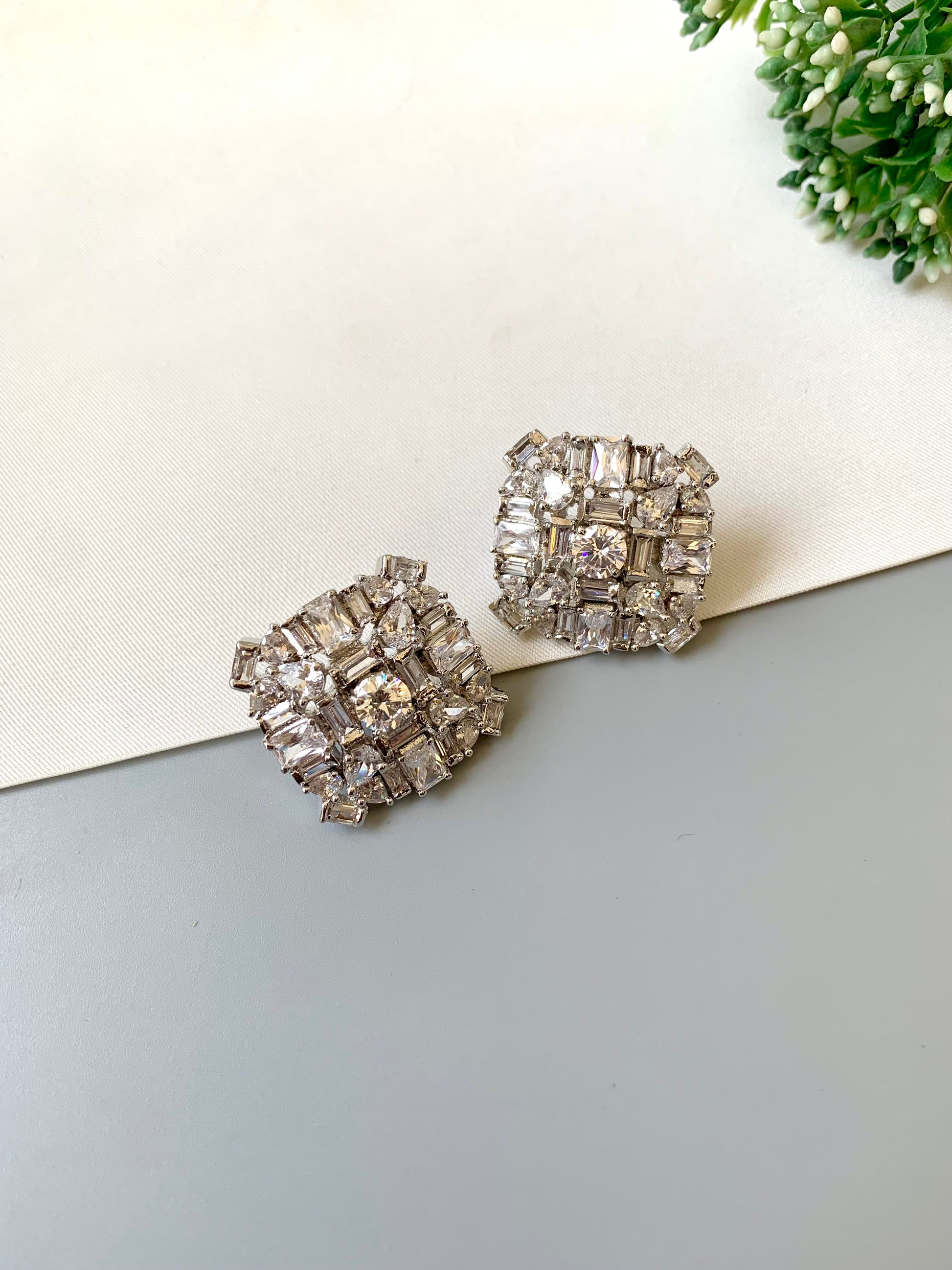 Rhodium-plated Lumière Solitaire Studs with high-quality American Diamonds and diamond finish