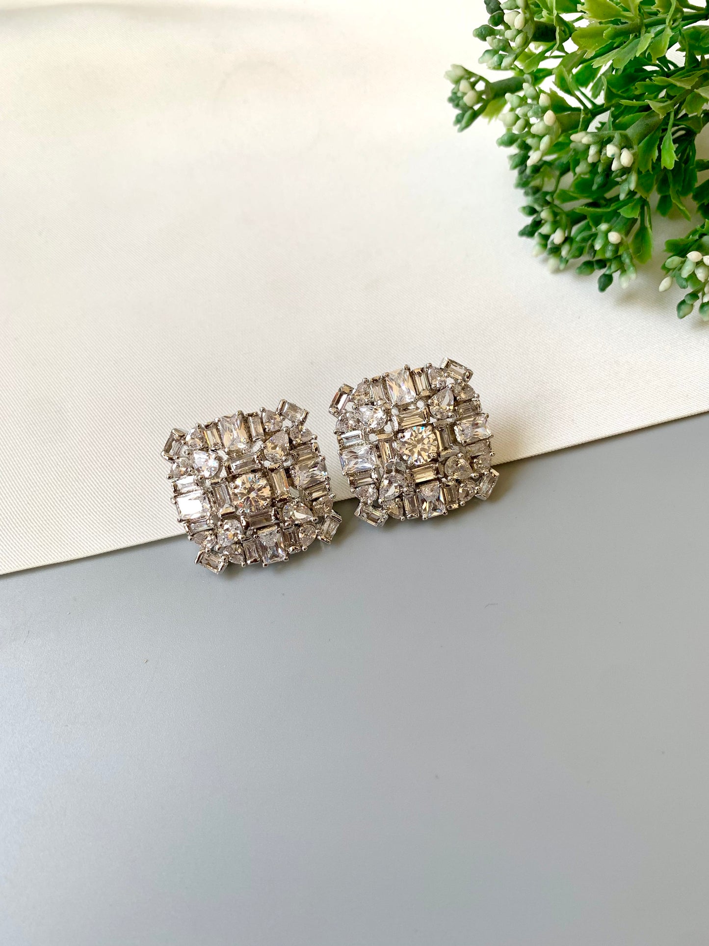 Rhodium-plated Lumière Solitaire Studs with high-quality American Diamonds and diamond finish