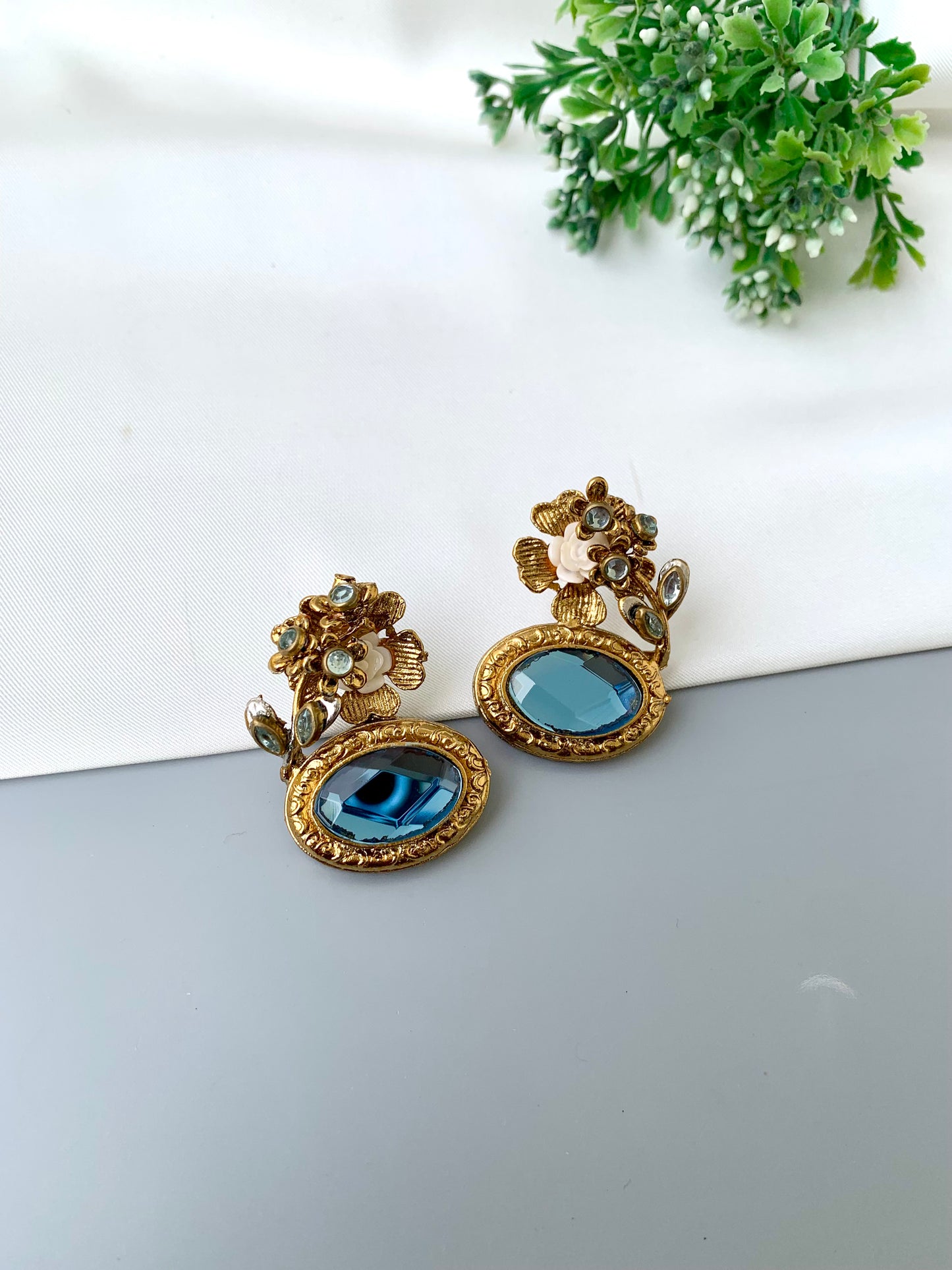 Maha floral kundan earrings in gold plating with acrylic flowers and gemstone detailing