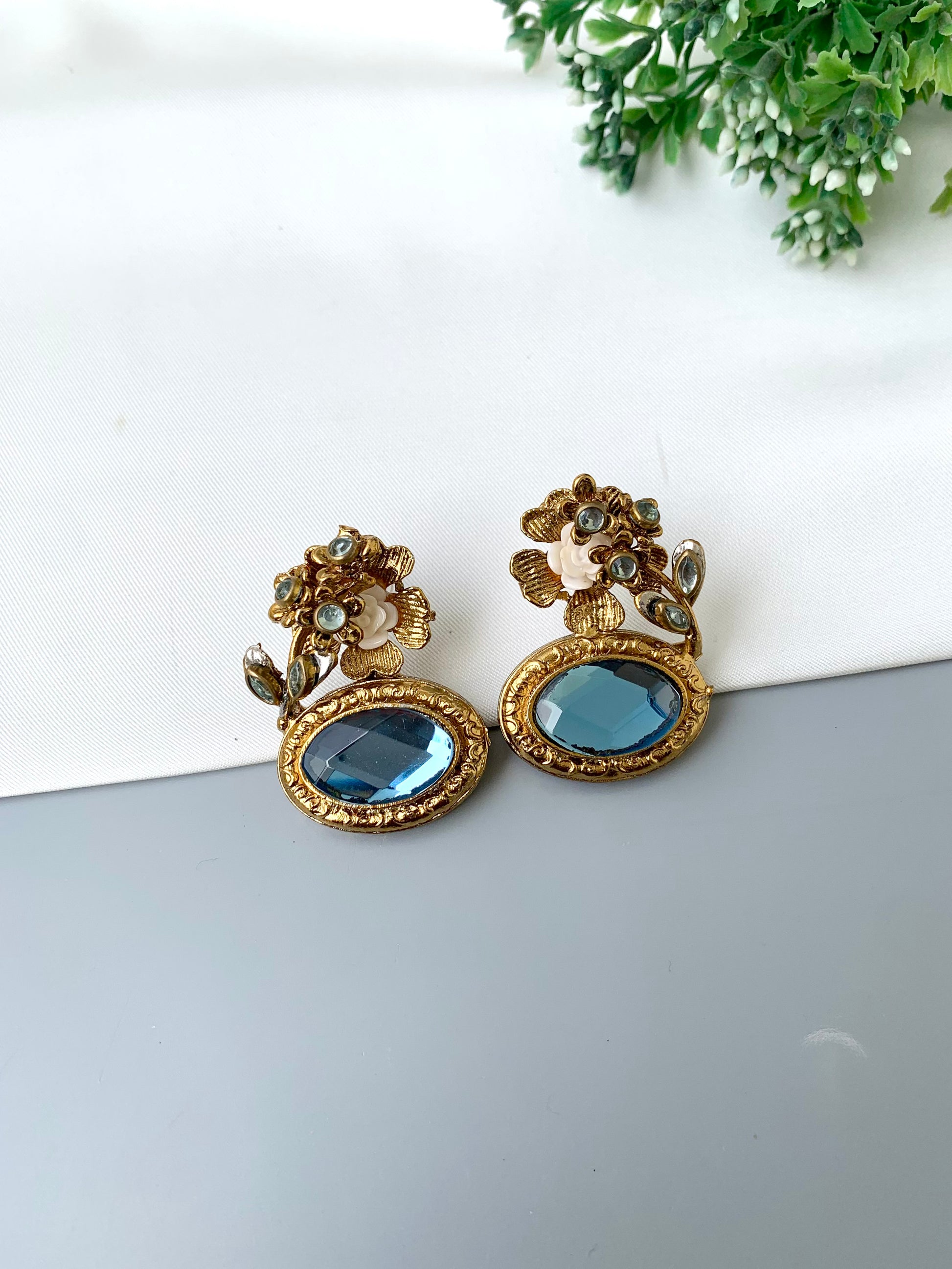 Maha floral kundan earrings in gold plating with acrylic flowers and gemstone detailing