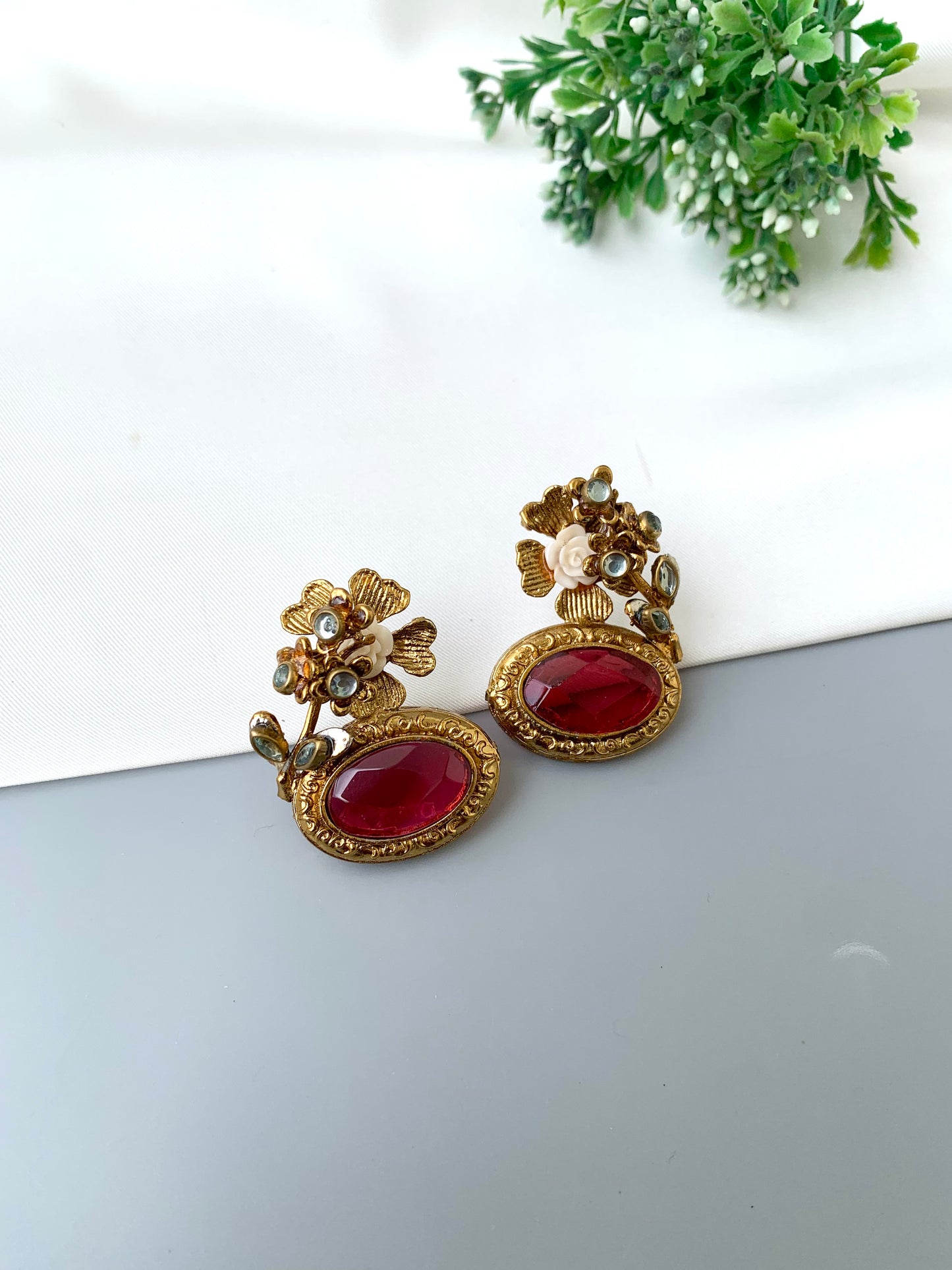 Maha floral kundan earrings in gold plating with acrylic flowers and gemstone detailing