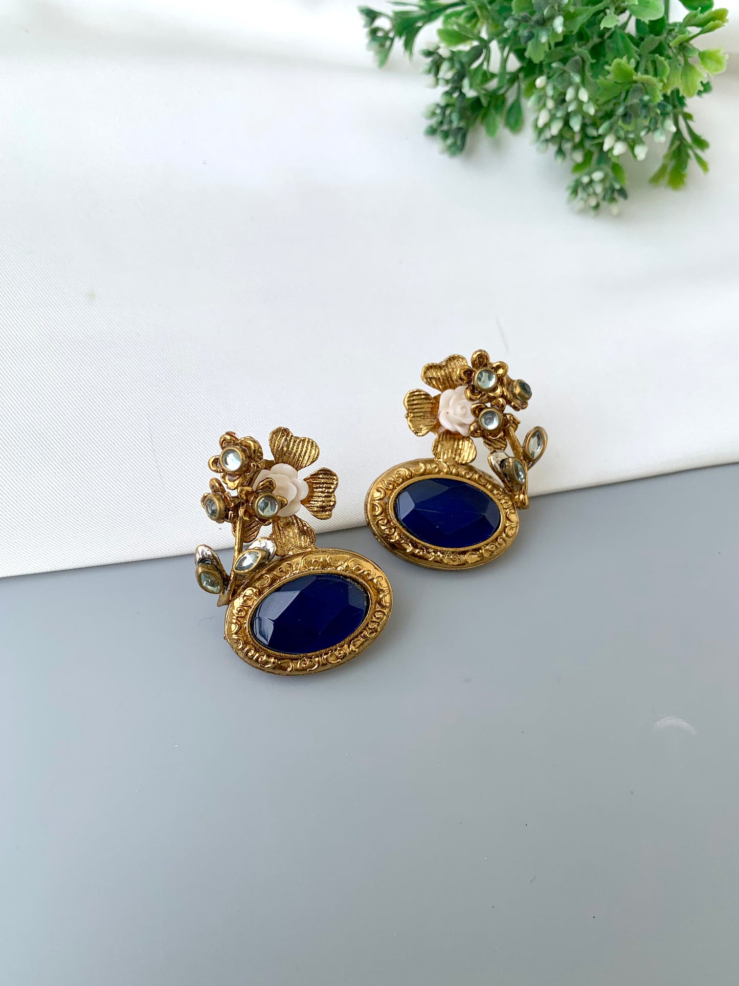 Maha floral kundan earrings in gold plating with acrylic flowers and gemstone detailing