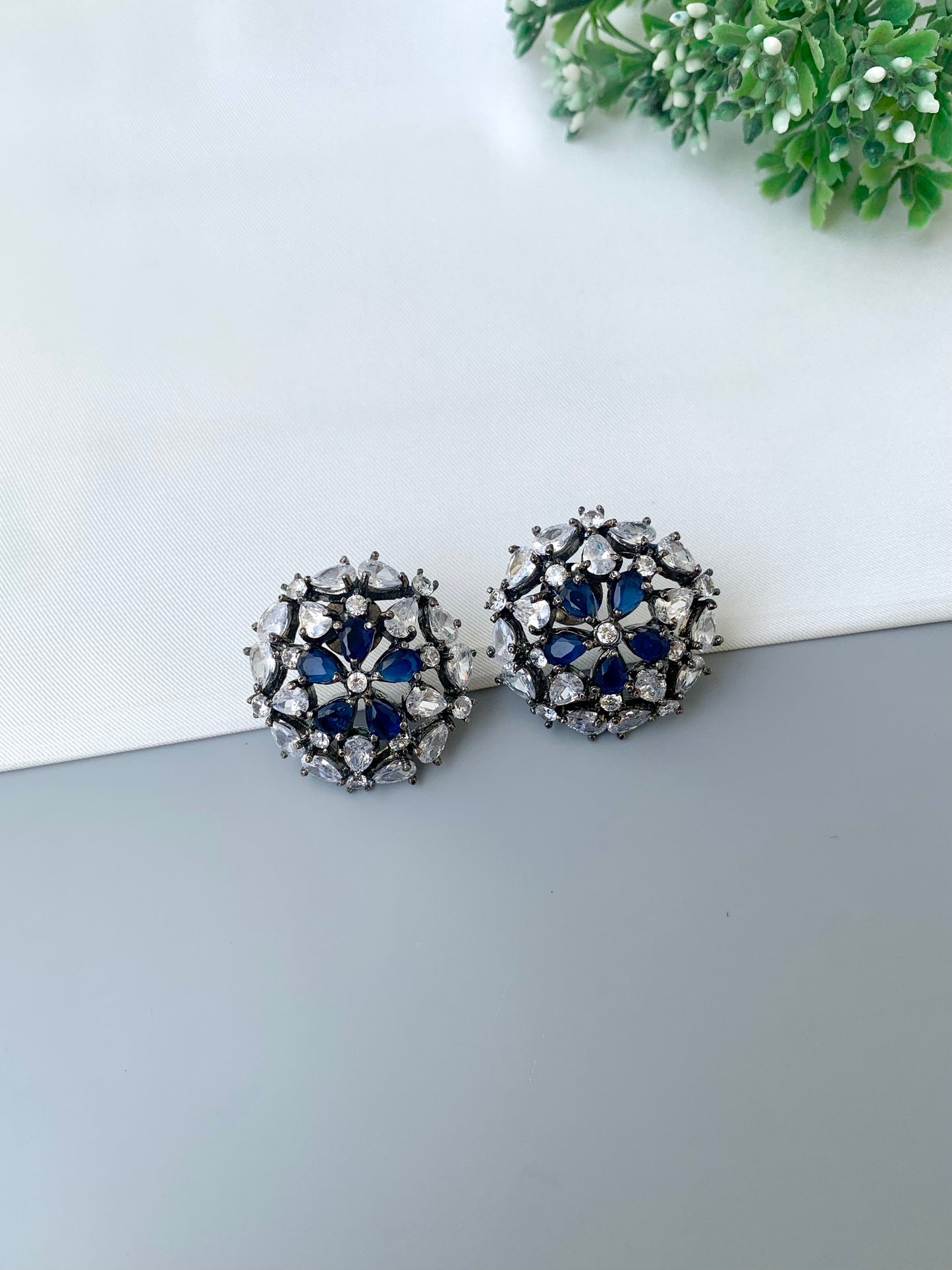 Marvi rhodium plated oxidized studs with American diamonds and sapphire accents