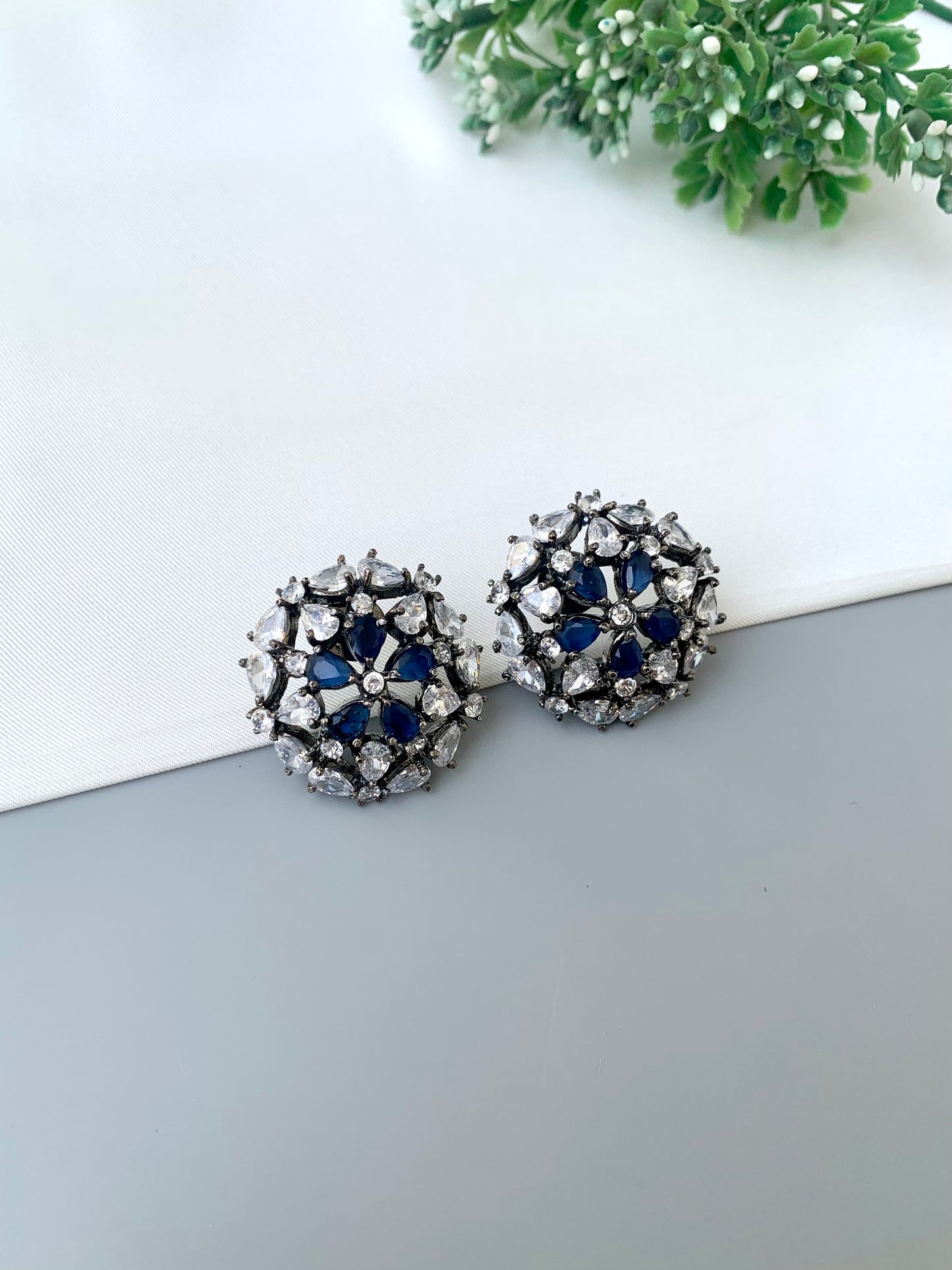 Marvi rhodium plated oxidized studs with American diamonds and sapphire accents
